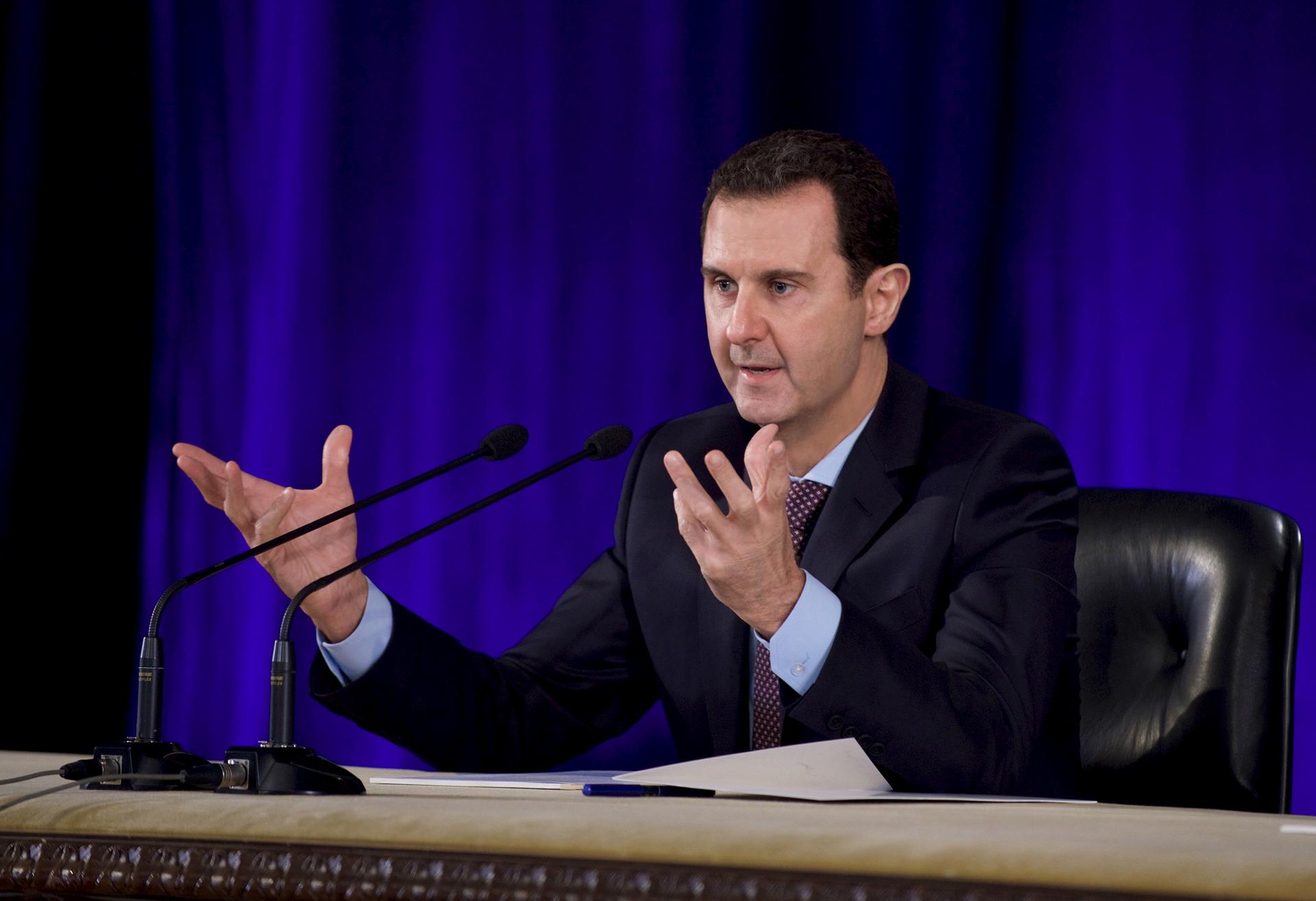 Syrian President Bashar al-Assad speaks during a meeting of the Central Bar Association in Damascus, Syria, Feb. 15, 2016.
