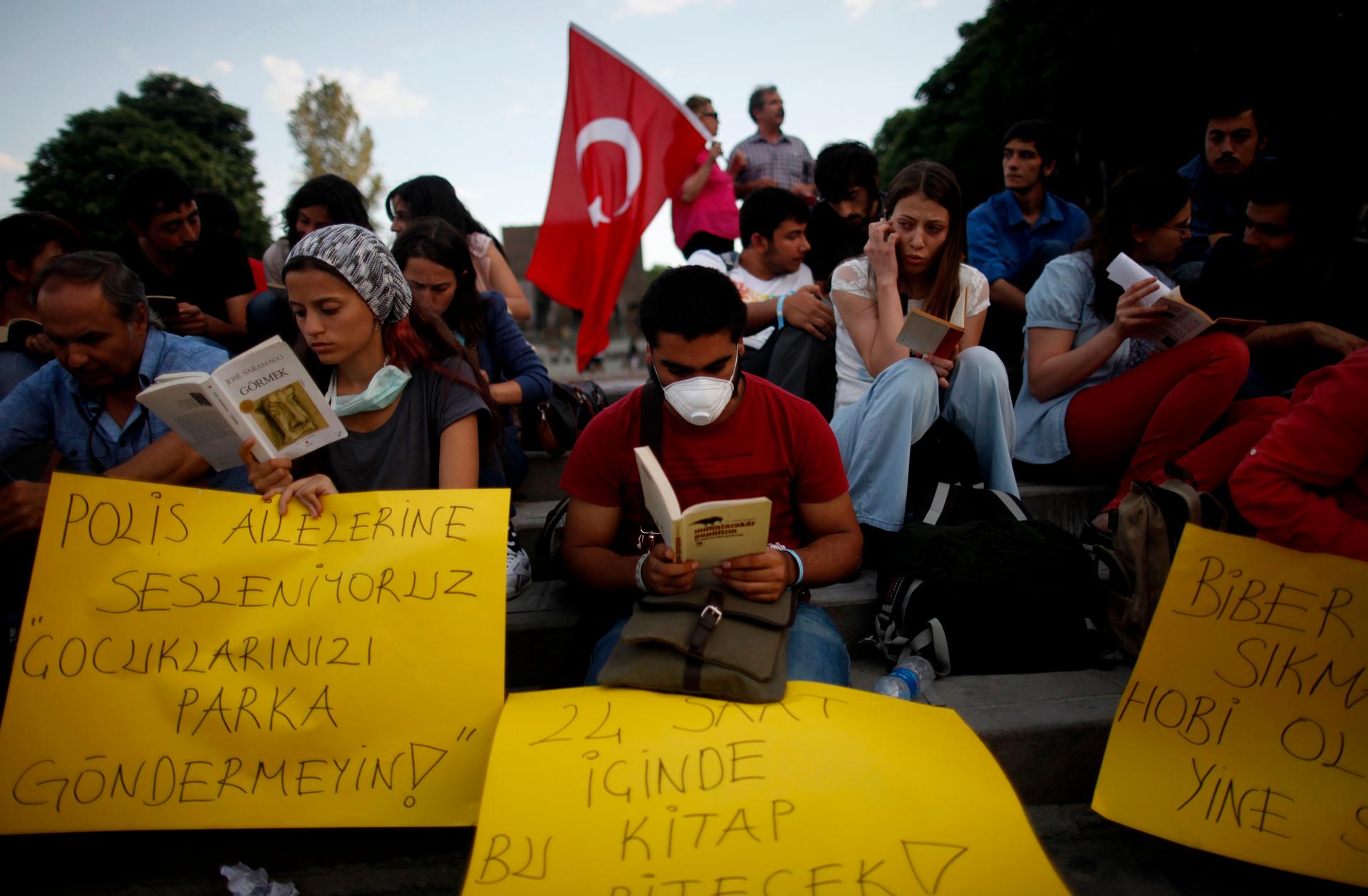 Anti-government protesters read books at Kizilay square in central Ankara June 12, 2013. About 50 protesters gathered at the square to read books in an attempt to circumvent police bans against mass gatherings and protests in the capital.