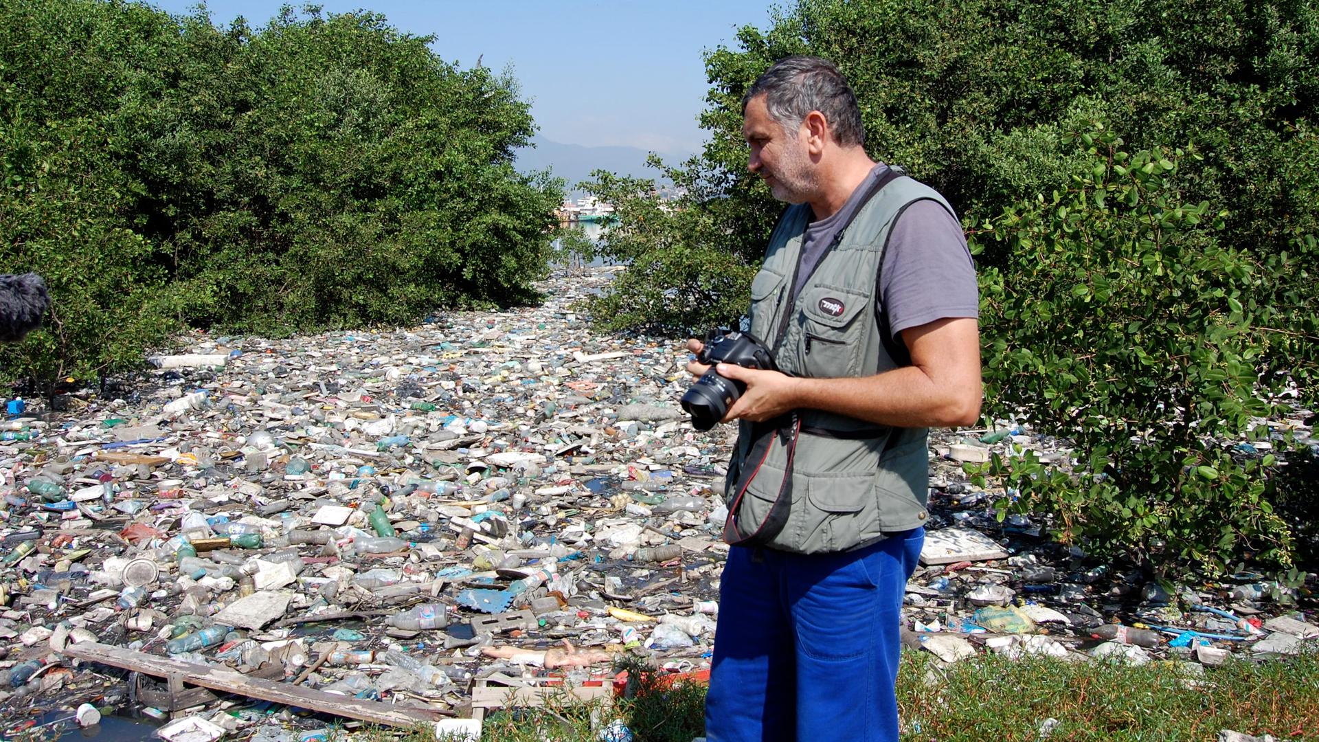 Biologist Mario Moscatelli along the shores of Guanabara Bay in Rio