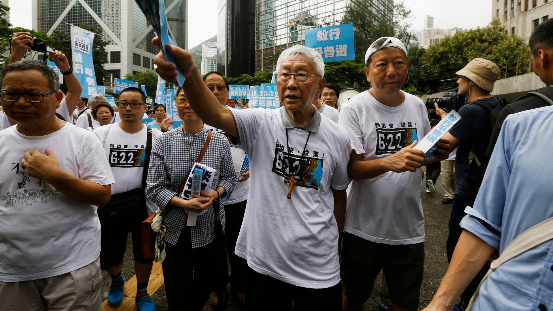 The 82 year-old Cardinal Joseph Zen (center) is the former head of the Roman Catholic Church in Hong Kong and a supporter of the student-led pro-democracy campaign in the Chinese territory. 