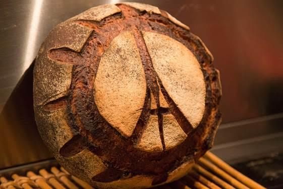 The iconic Eiffel Tower peace symbol on a loaf of French bread.