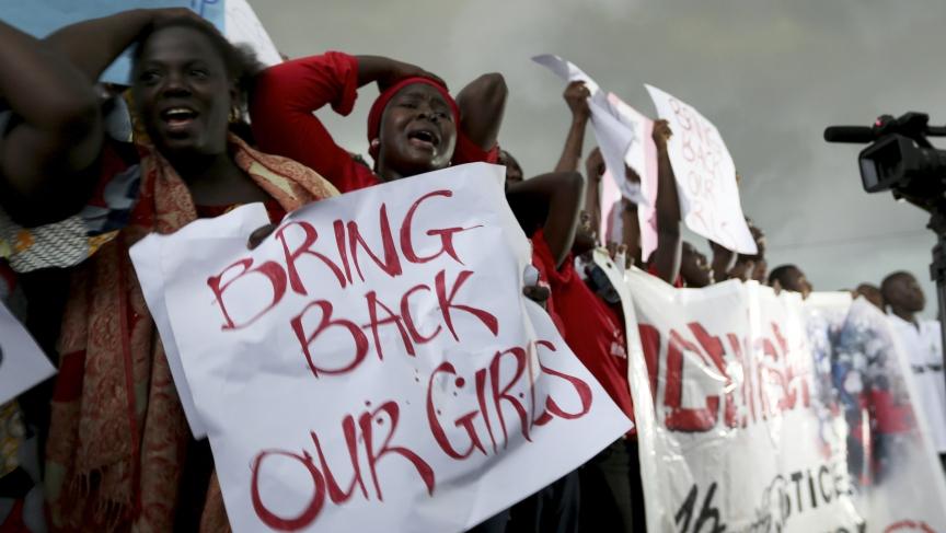 Women react during a protest demanding that Nigerian security forces search harder for 200 schoolgirls abducted by Islamist militants.