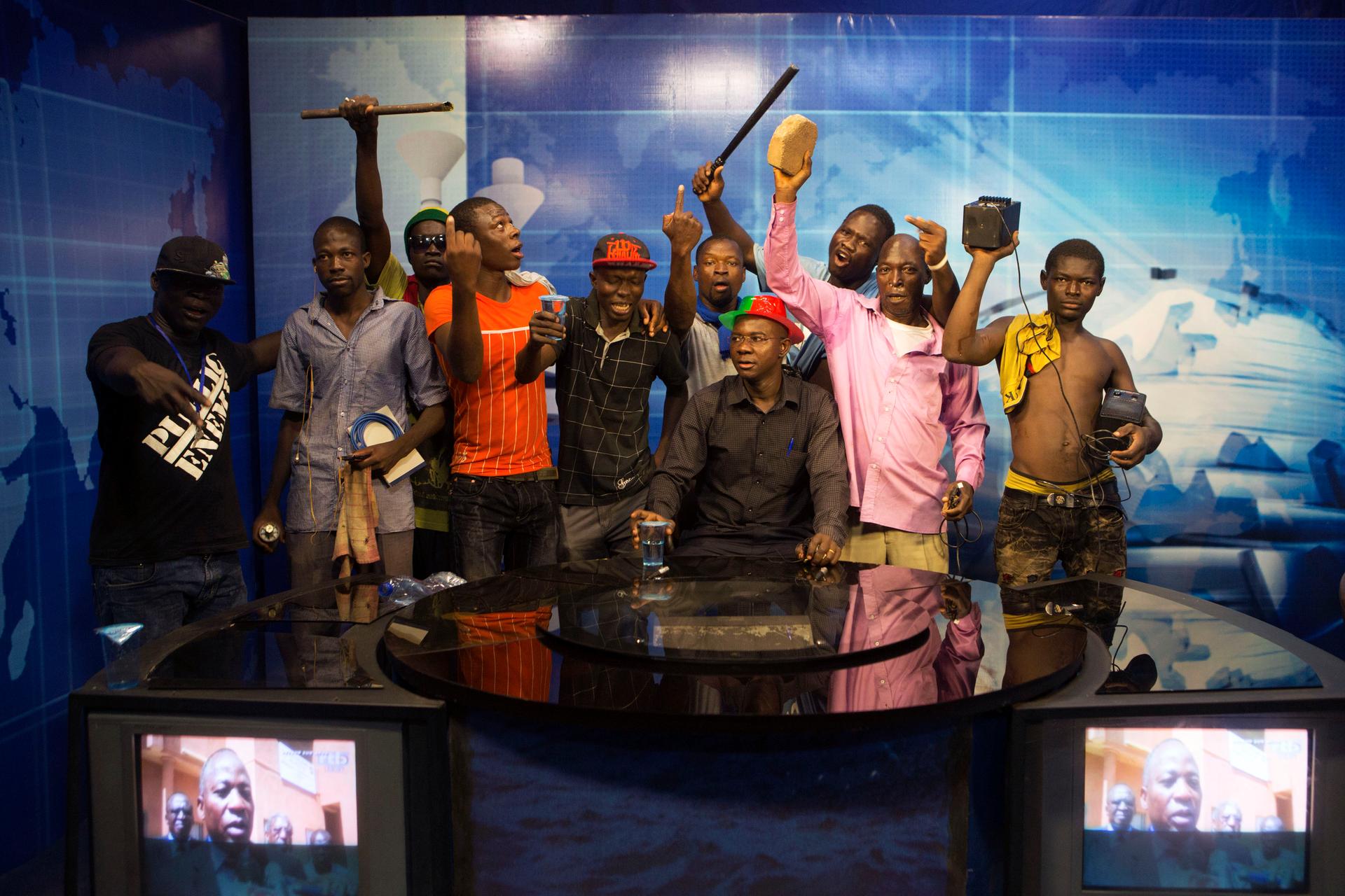 Anti-government protesters at a TV station in Burkina Faso