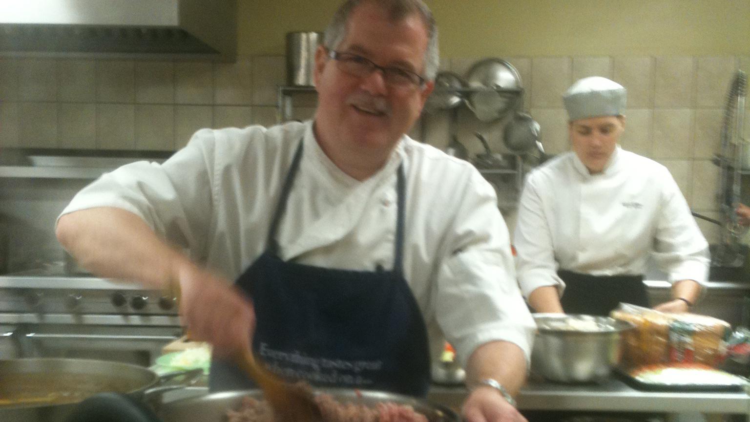 Chef Marc Miron busy in the kitchen at his Cuisine & Passion gourmet shop.