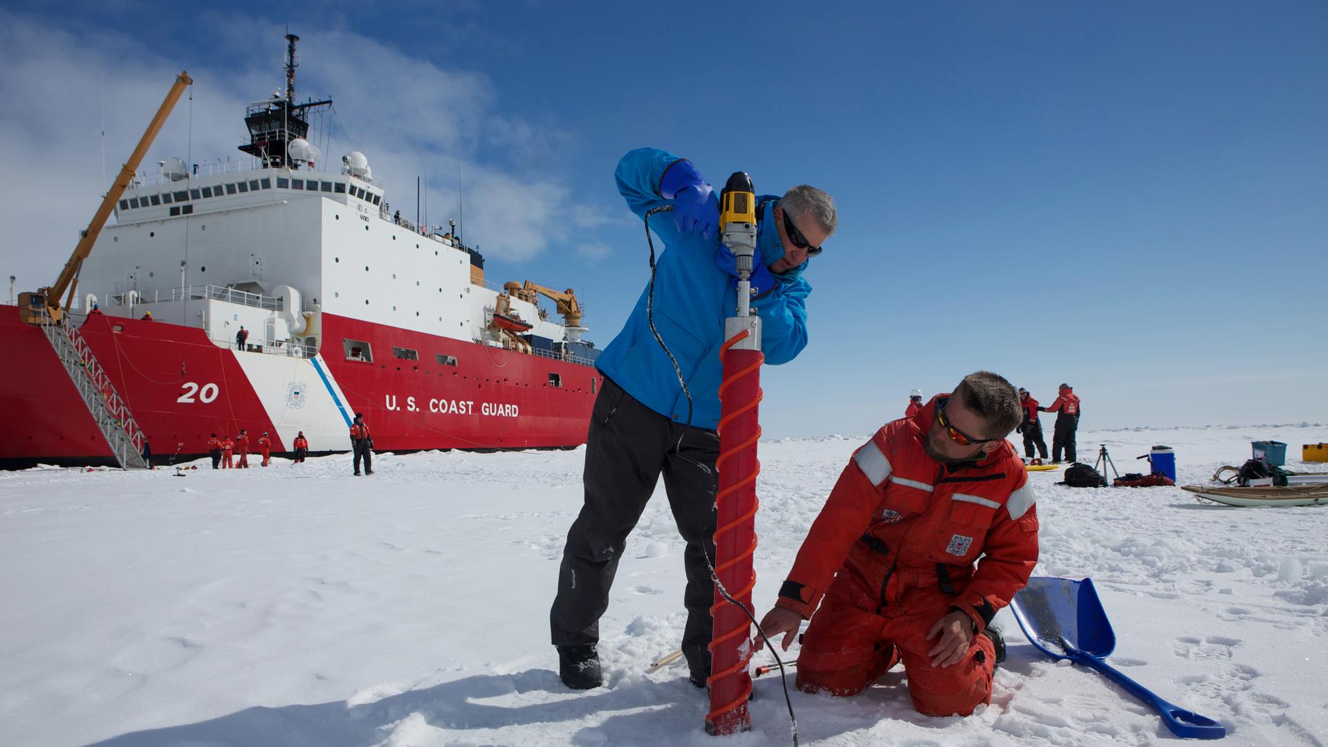 Ice scientists Ken Golden and Chris Polashenski drill a plastic tube into the Arctic ice cap north of Alaska as part of their research into melt ponds that form on the ice every spring. The ponds play a key role in the accellerated warming of the Arctic, 