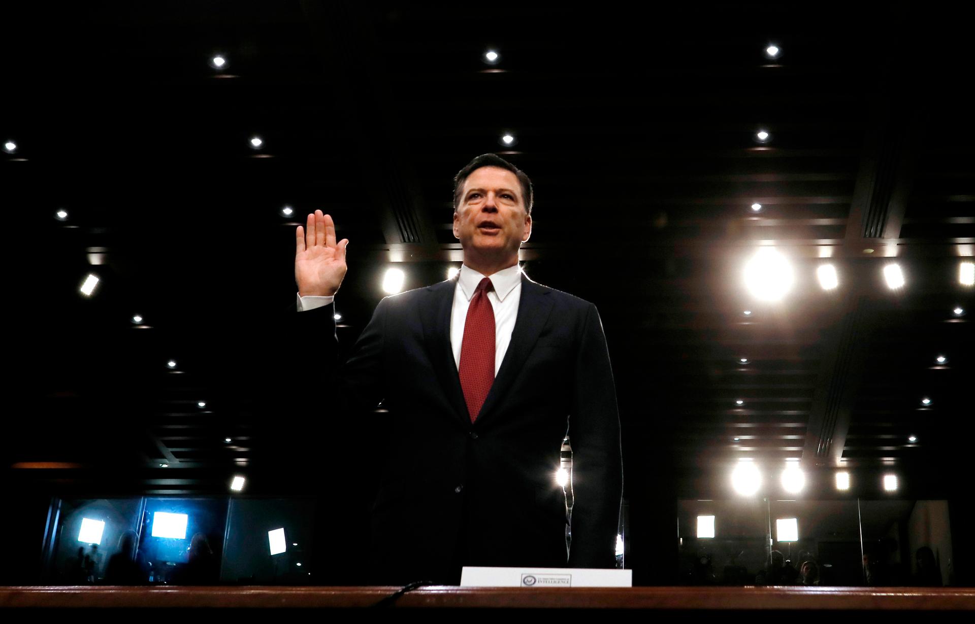 Former FBI Director James Comey is sworn in prior to testifying before a Senate Intelligence Committee