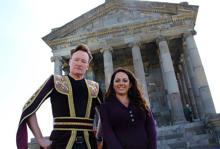 Late night comic Conan O'Brien in traditional folk dress and his TV assistant Sona Movsesian.