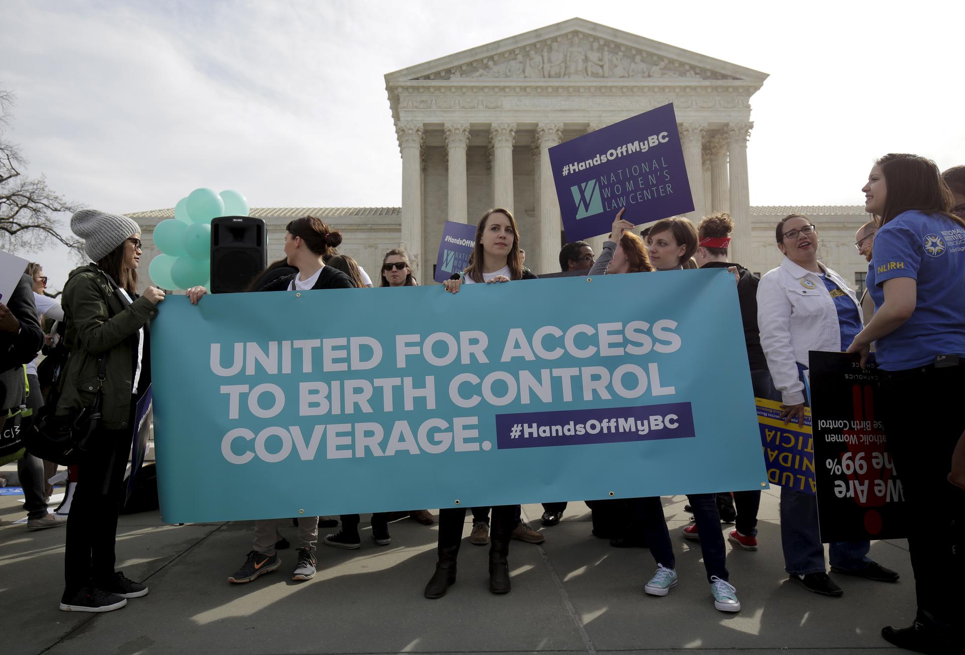 Supporters of contraception rally before Zubik v. Burwell is heard at the Supreme Court