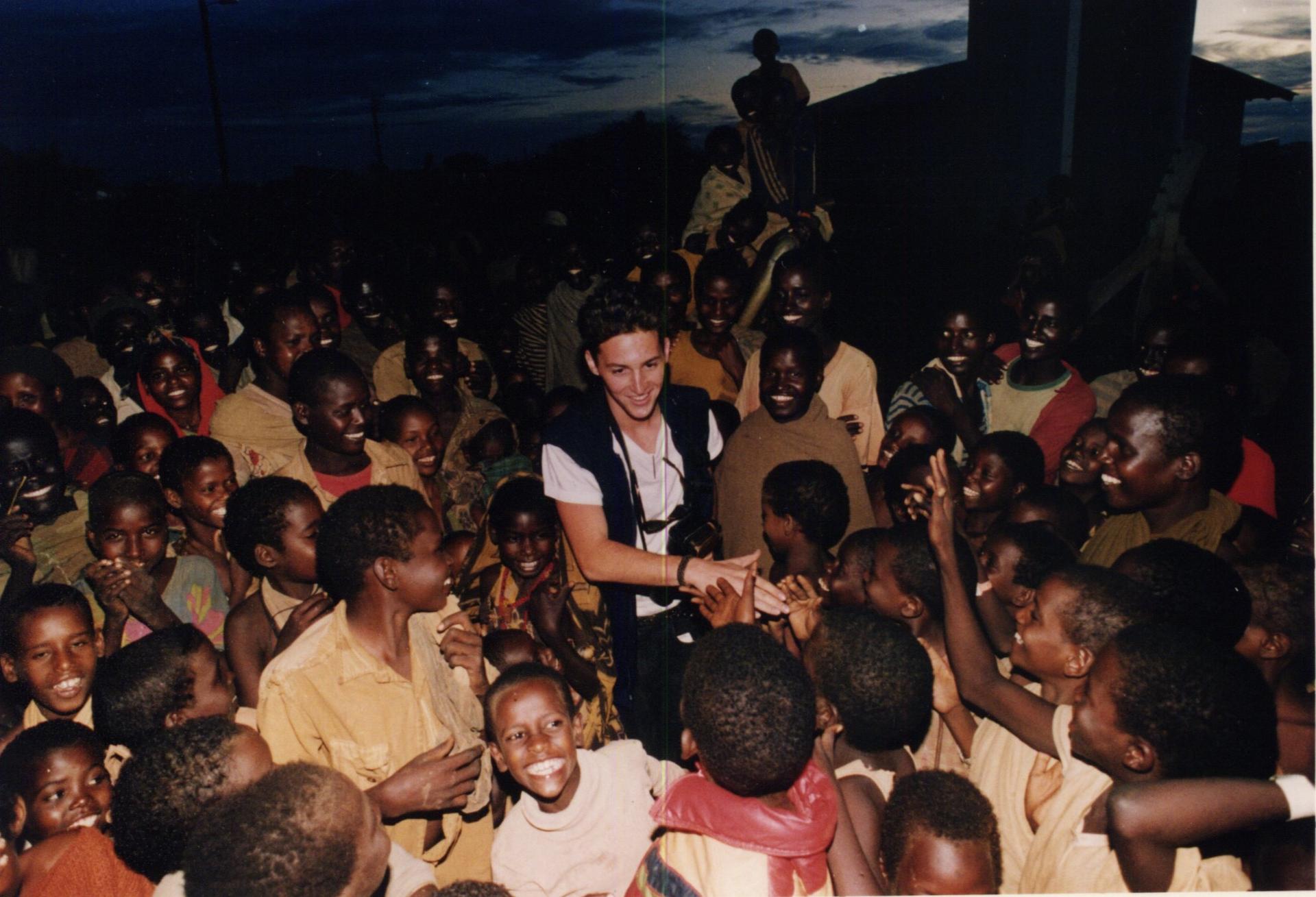 Dan Eldon surrounded by Somali children.