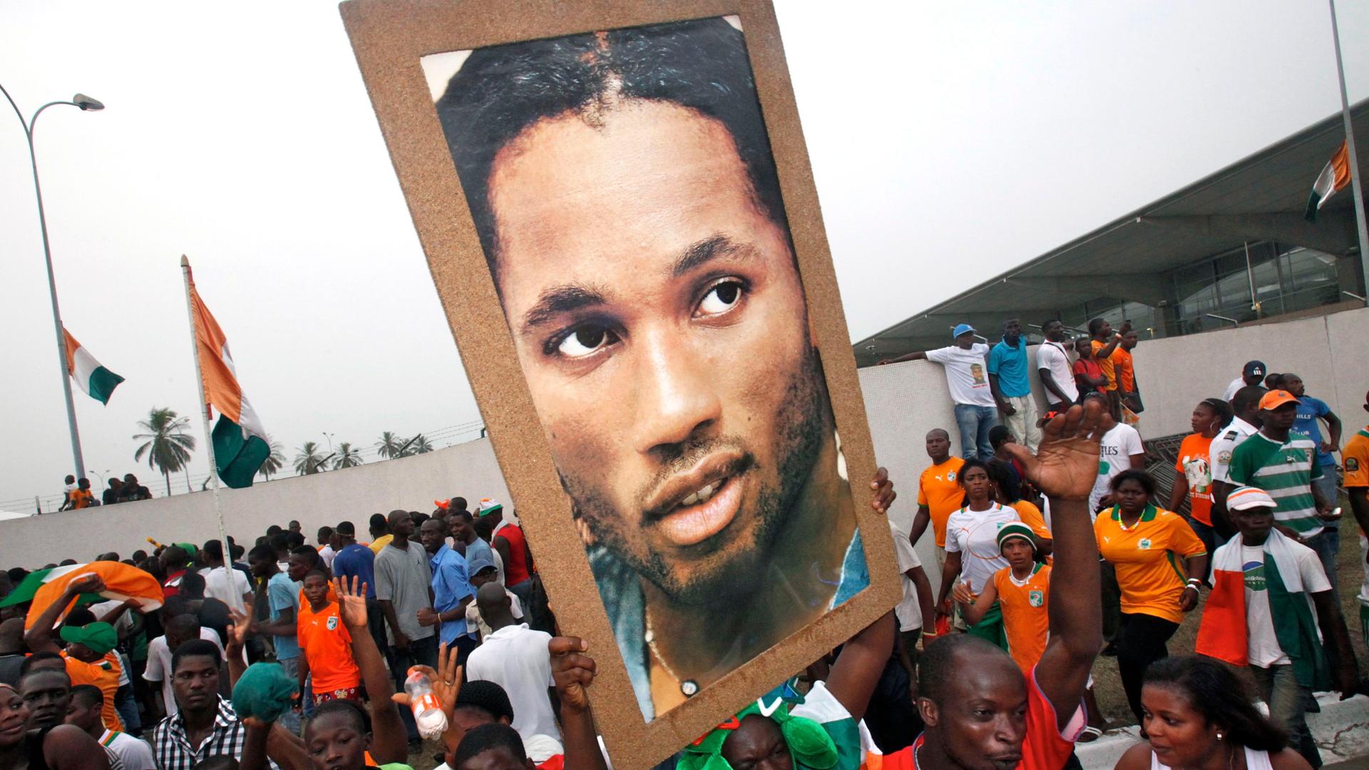 Fans in Abidjan, Ivory Coast, cheer for their hero, Didier Drogba. Drogba, a former African Player of the Year, is the inspiration for the term, 'drogbacité.'