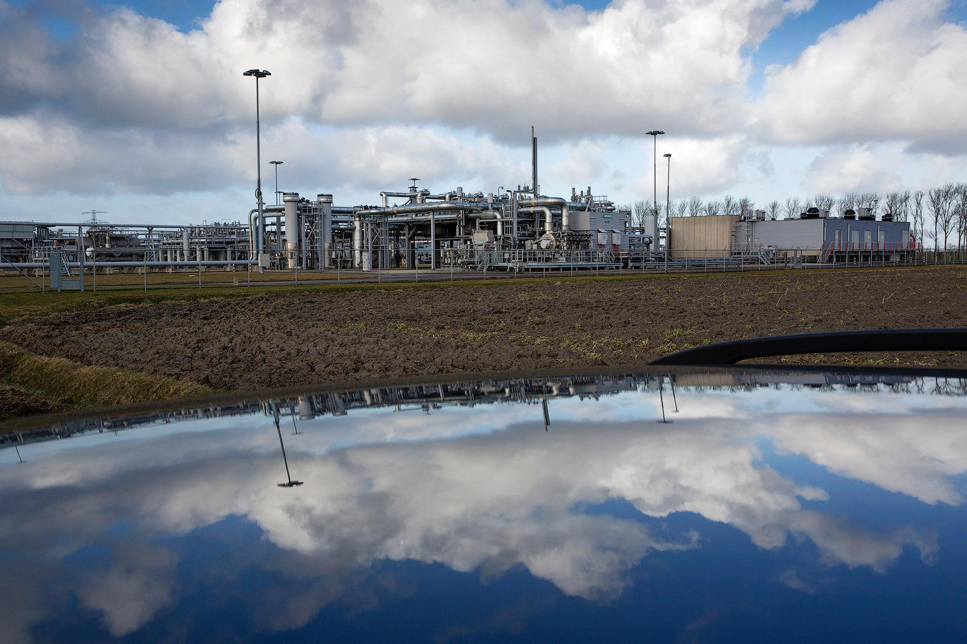 A view of a gas production plant is reflected in the roof of a car in 't Zand in Groningen February 24, 2015