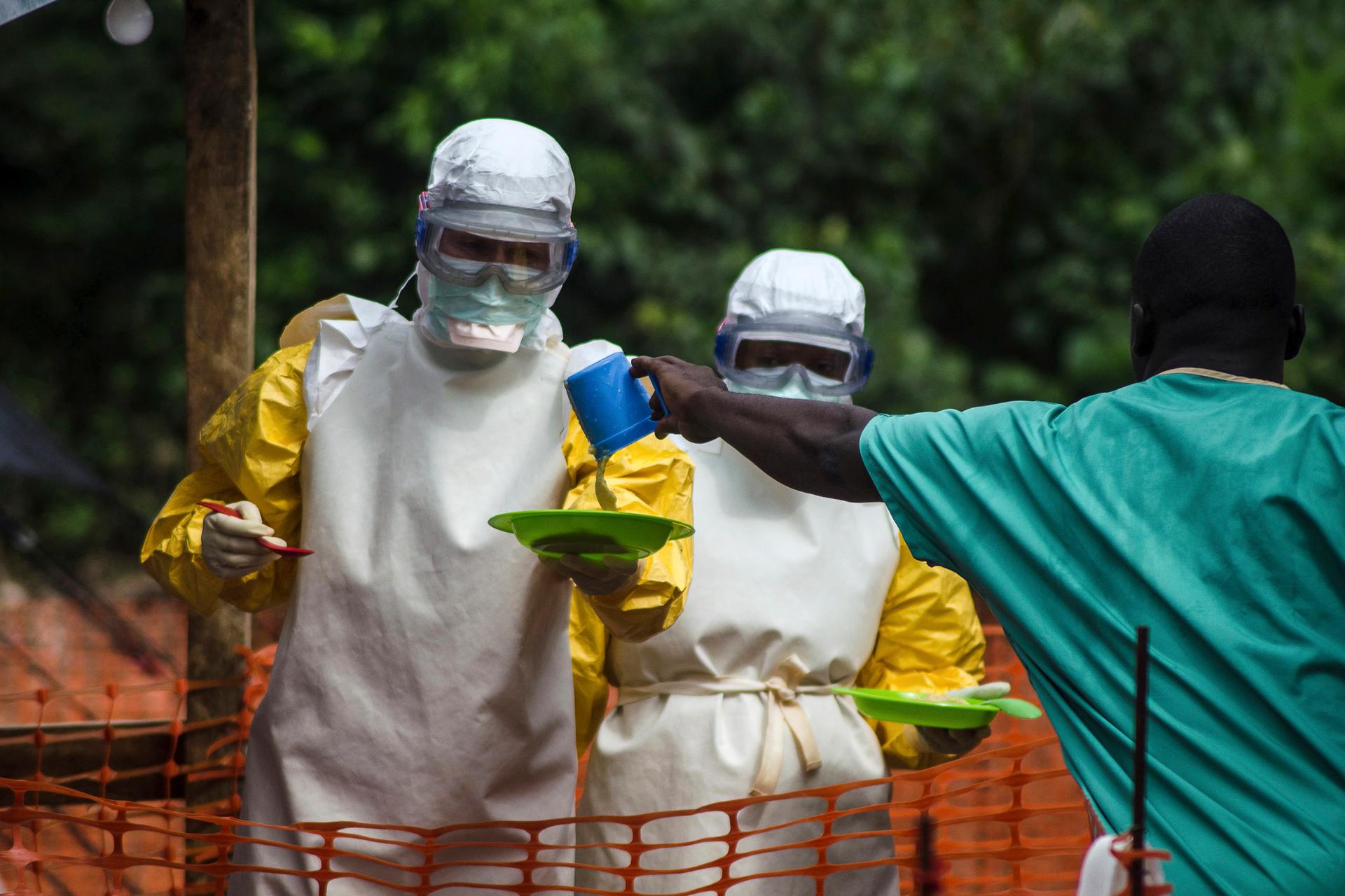Medical staff working with Medecins sans Frontieres (MSF) prepare to bring food to patients kept in an isolation area at the MSF Ebola treatment centre in Kailahun July 20, 2014.
