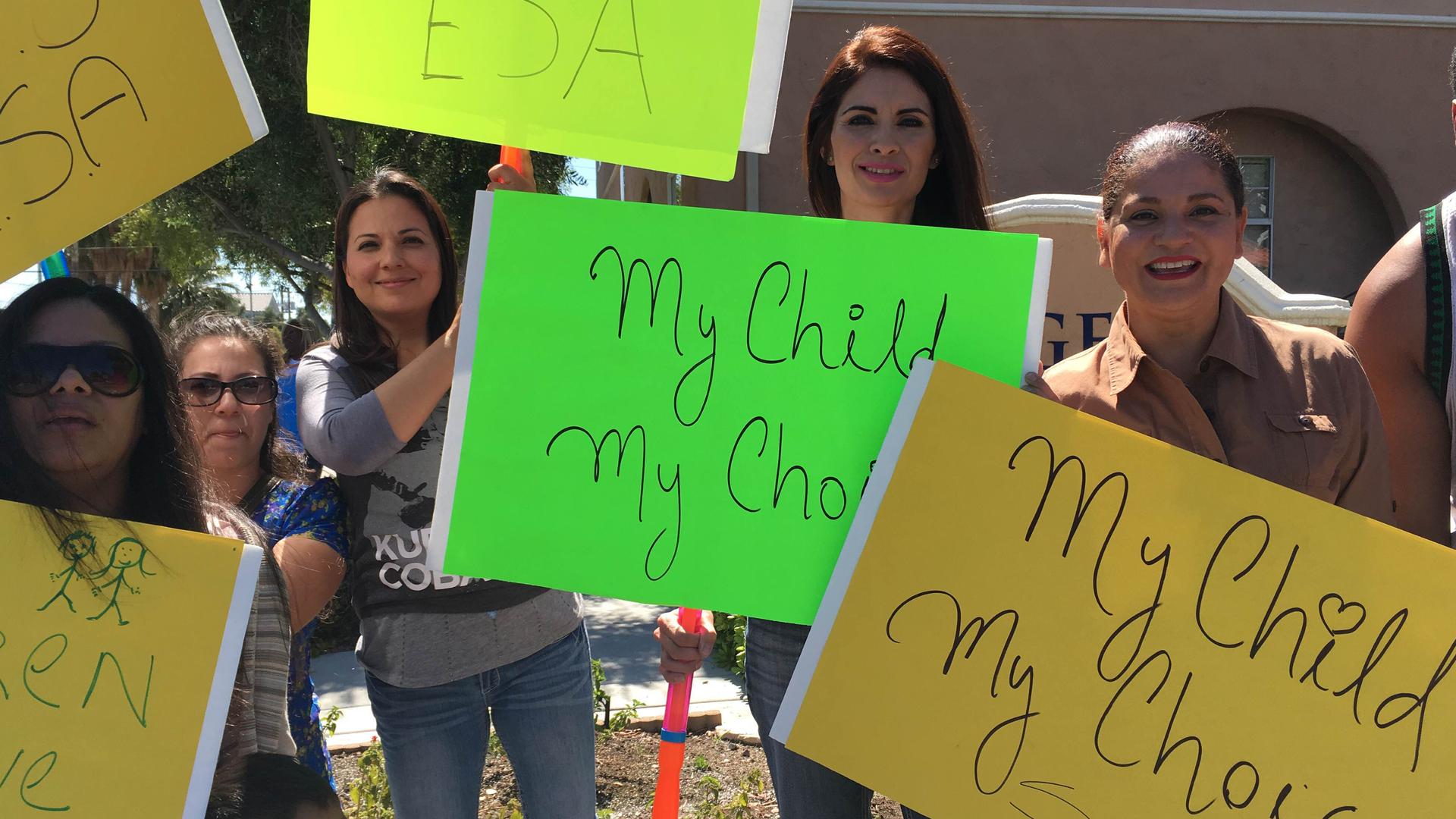 Las Vegas moms rally in favor educational savings accounts, allowing for taxpayer money for children to attend private schools in Nevada. Also pictured, Coco Llenas (right), with the Nevada School Choice Partnership. May 3, 2016.