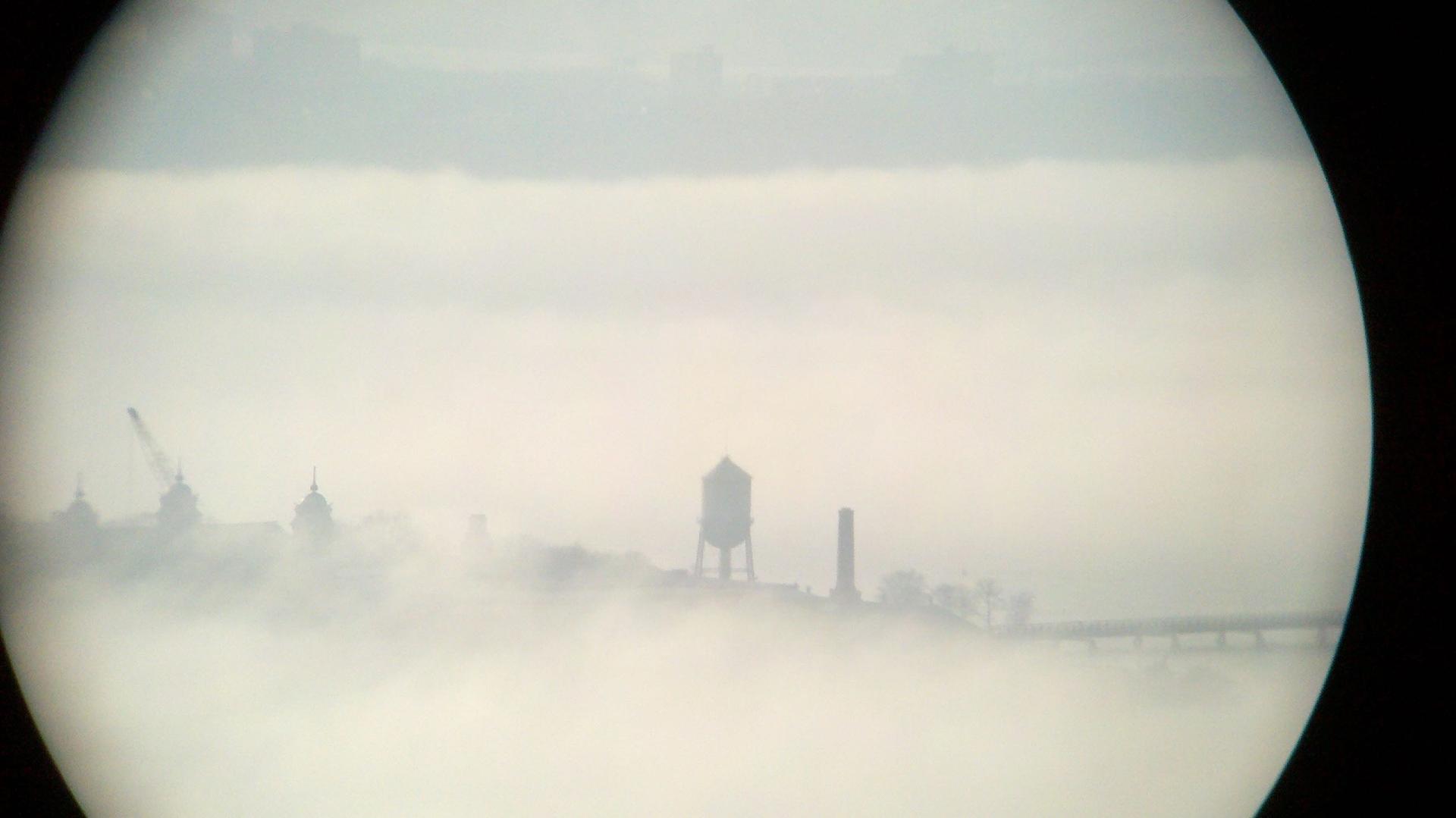 Ellis Island — which once welcomed millions of immigrants to the US — is pictured here shrouded in fog. 