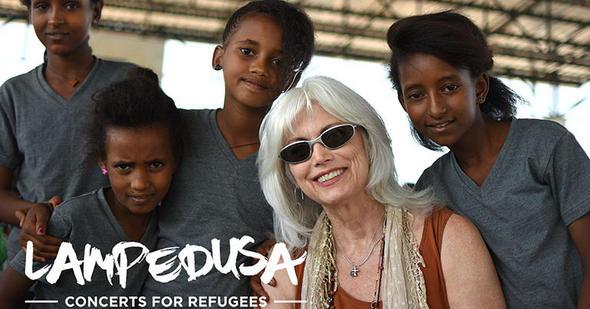 Emmylou Harris is pictured with Eritrean refugees.