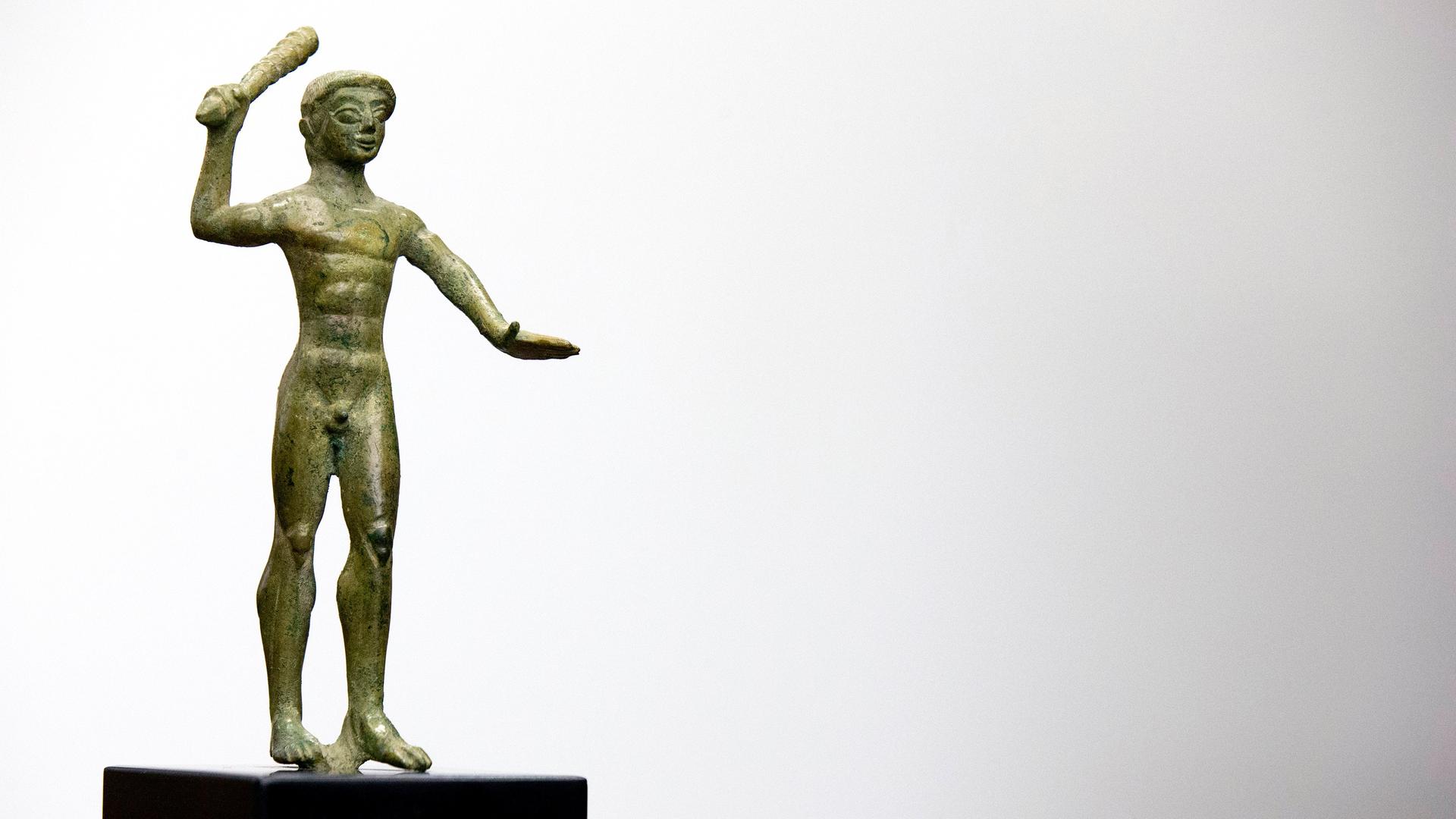 An ancient Etruscan bronze statuette of Herakles dating from the 6th or 5th Century B.C. 