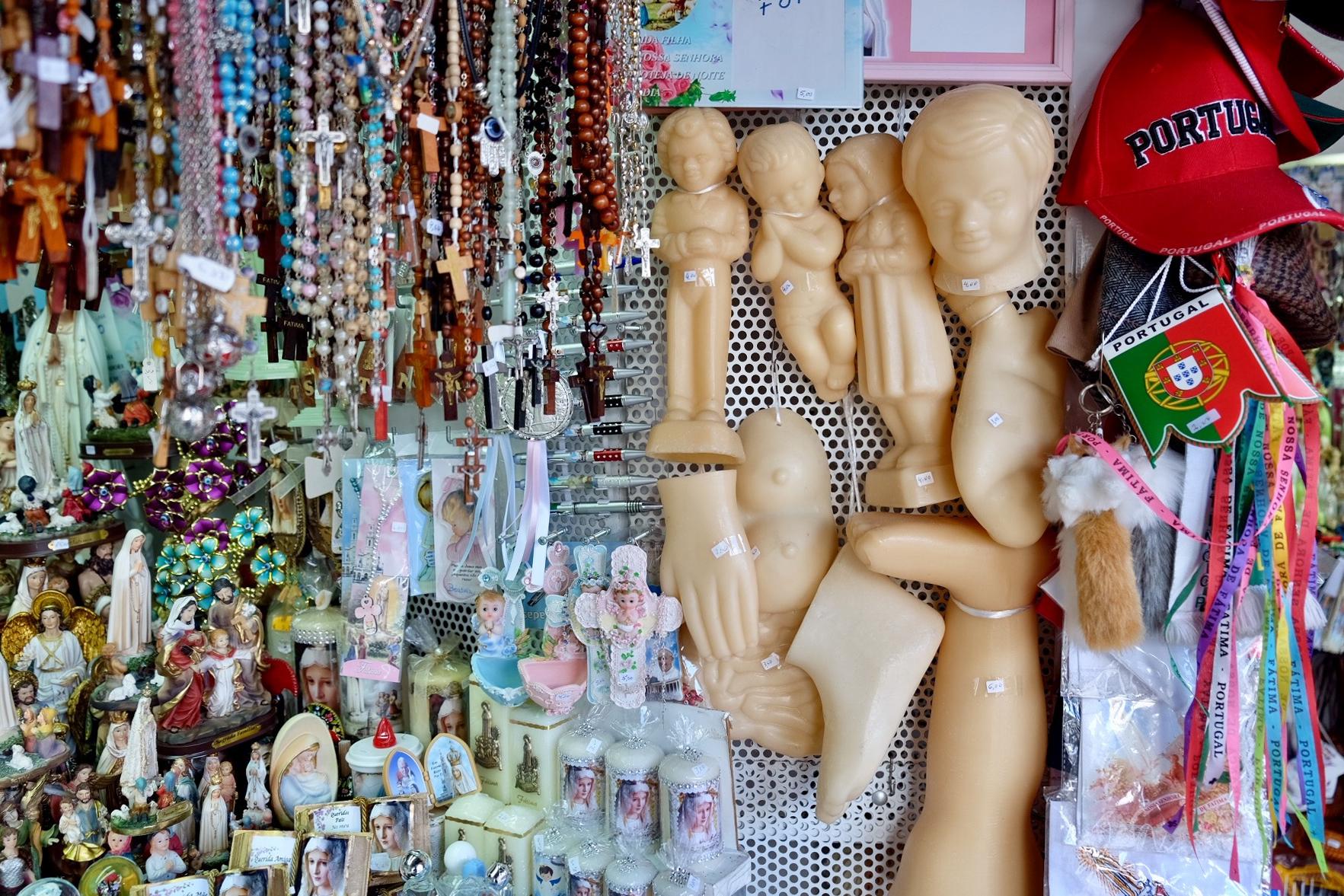 Souvenirs and wax figurines for sale in Fatima, Portugal