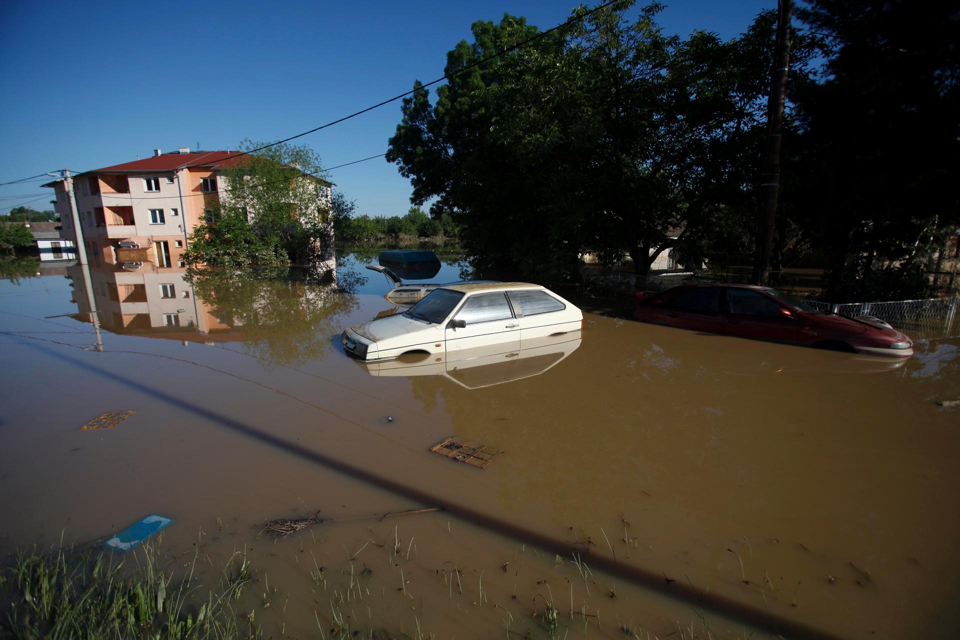 A car is seen stranded in the flooded town of Obrenovac, southwest of Belgrade.