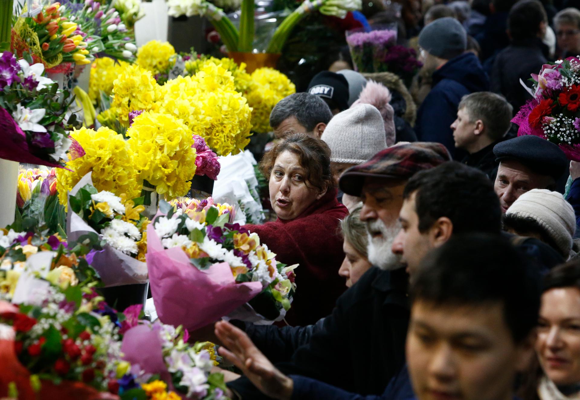 A vendor sells flowers for the upcoming International Women's Day at the Rizhsky flower market in Moscow, Russia March 7, 2017.