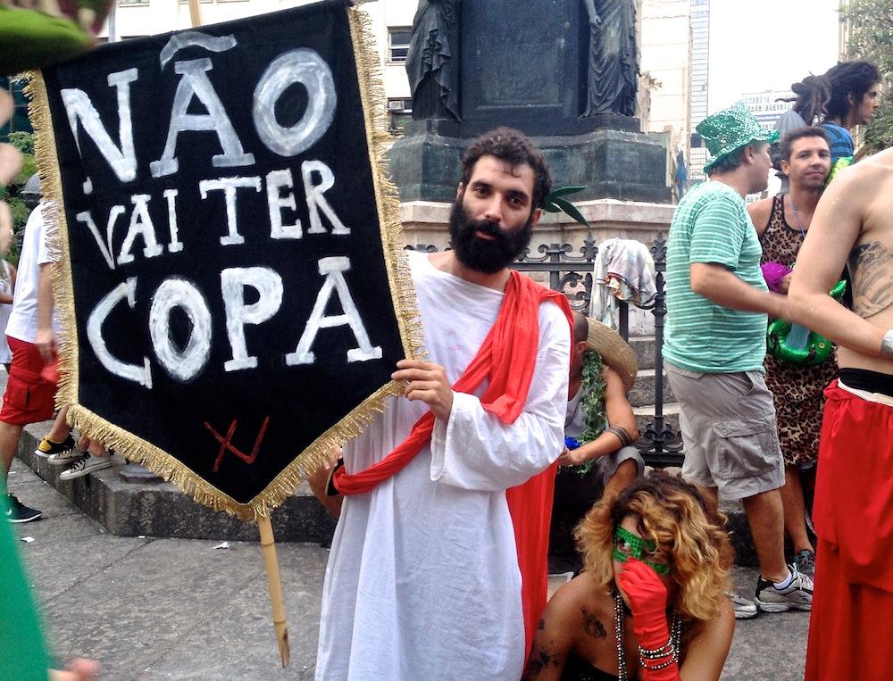 An anti-World Cup "Roman" takes a breather after hours of singing and dancing at a Rio carnival party.