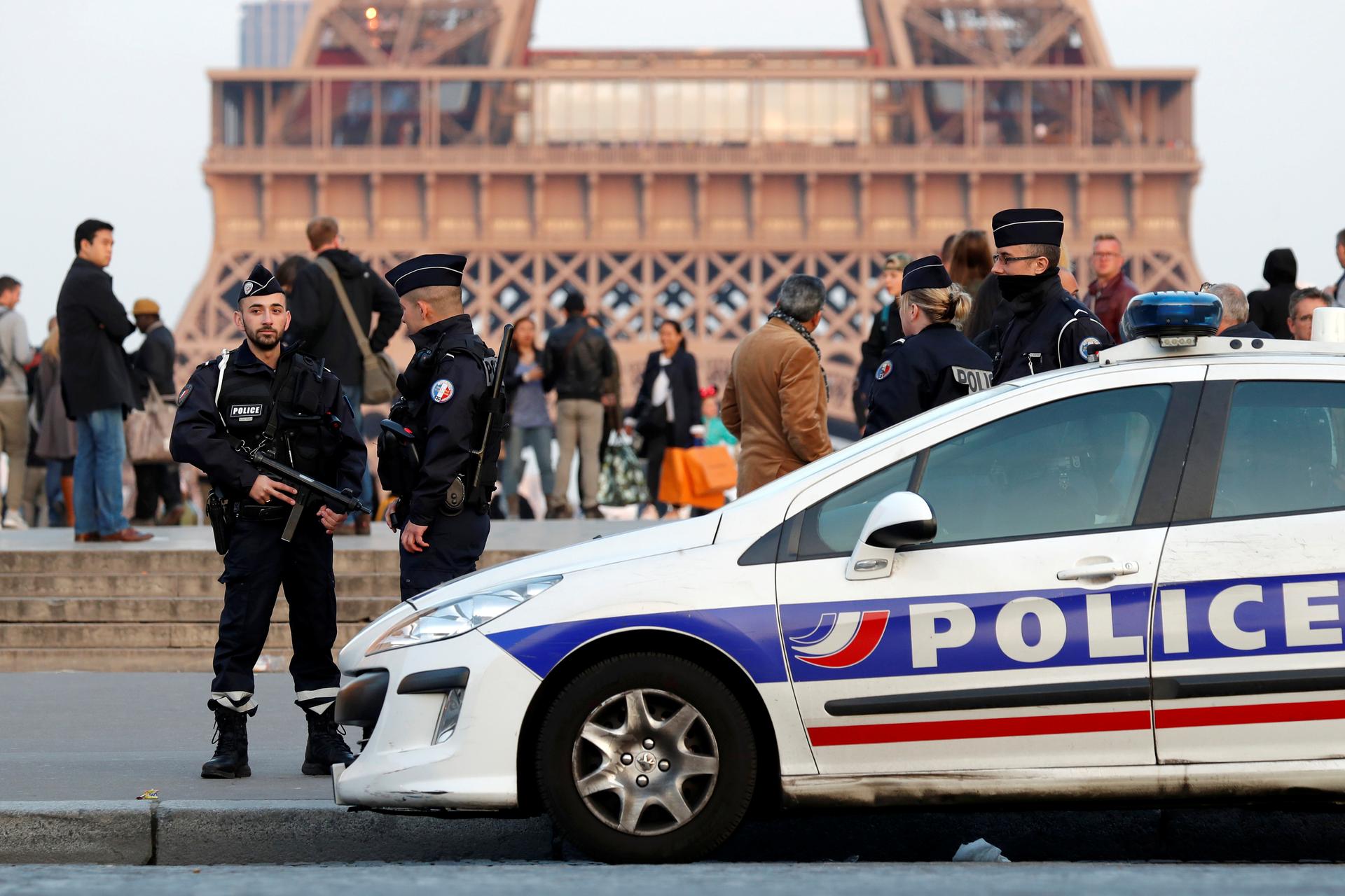 Police patrol at the Trocadero near the Eiffel Tower