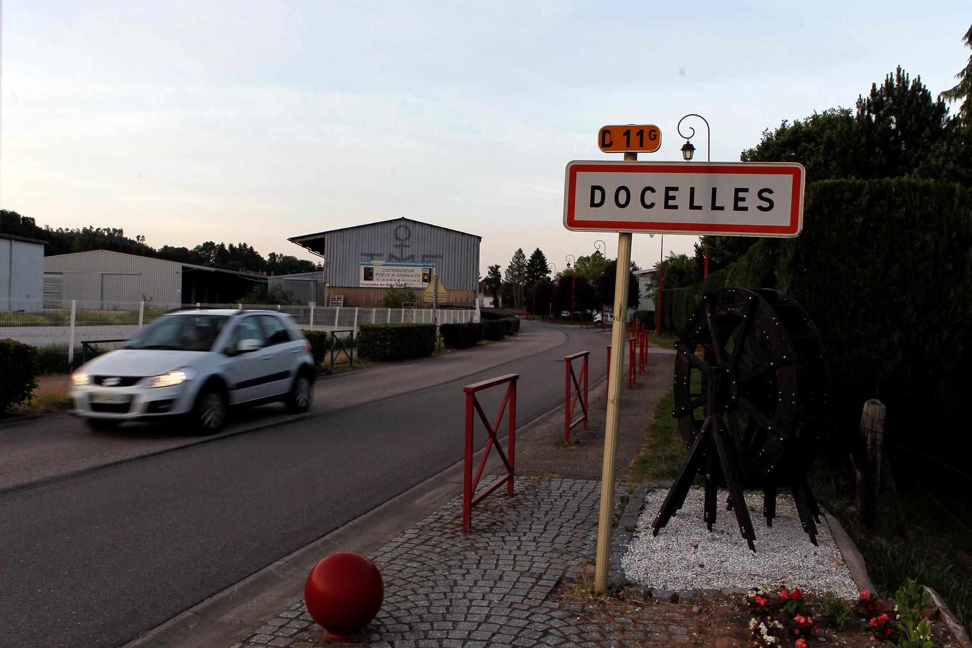 A car drives past the city entrance sign in Docelles, France, June 16, 2017.