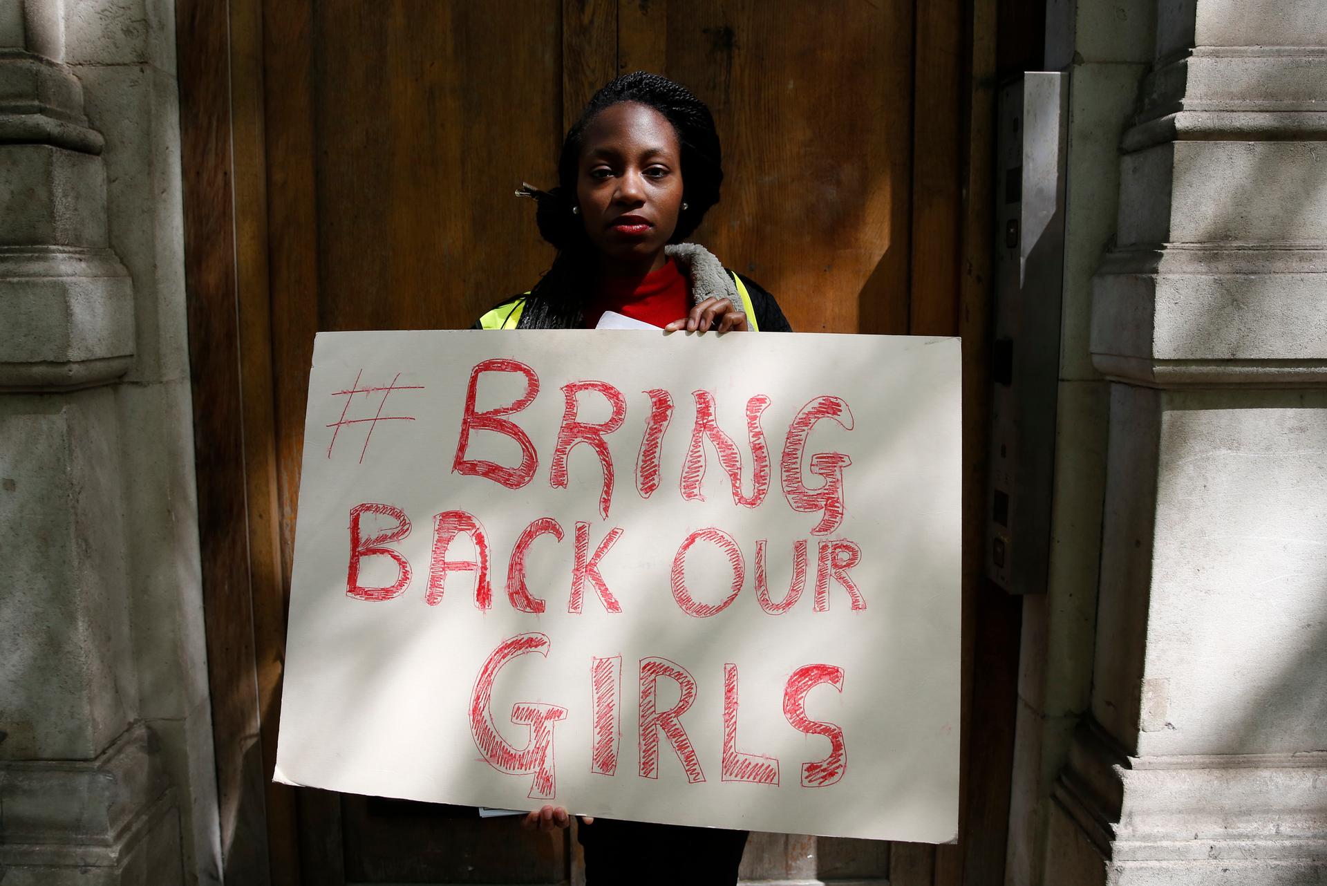 A protester outside the Nigerian Embassy in London holds a sign as she demonstrates against the kidnapping of school girls in Nigeria three weeks ago. There's been a world-wide outcry about the abductions carried about the Islamist militant group Boko Har