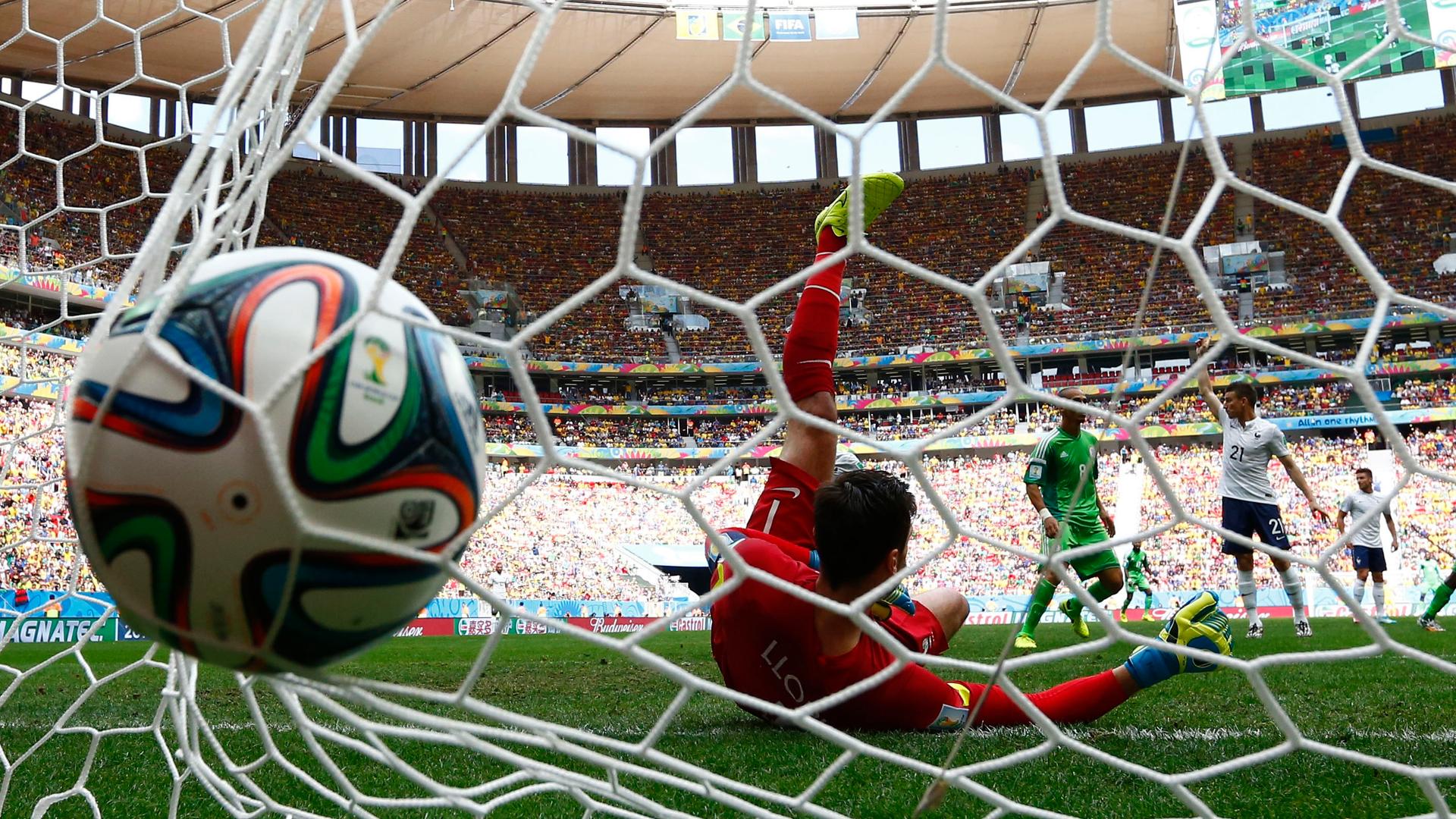 France's goalkeeper Hugo Lloris fails to stop a goal shot by Nigeria's Emmanuel Emenike, which was later disallowed, during their 2014 World Cup round of 16 game at the Brasilia national stadium in Brasilia June 30, 2014.