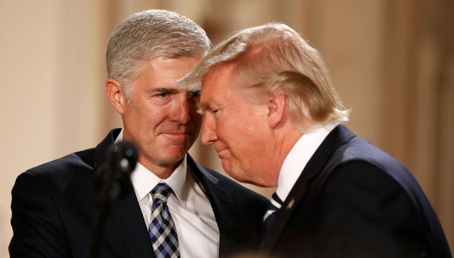 US President Donald Trump and Neil Gorsuch smile as Trump nominates Gorsuch to be an associate justice of the US Supreme Court at the White House in Washington, D.C., January 31, 2017.