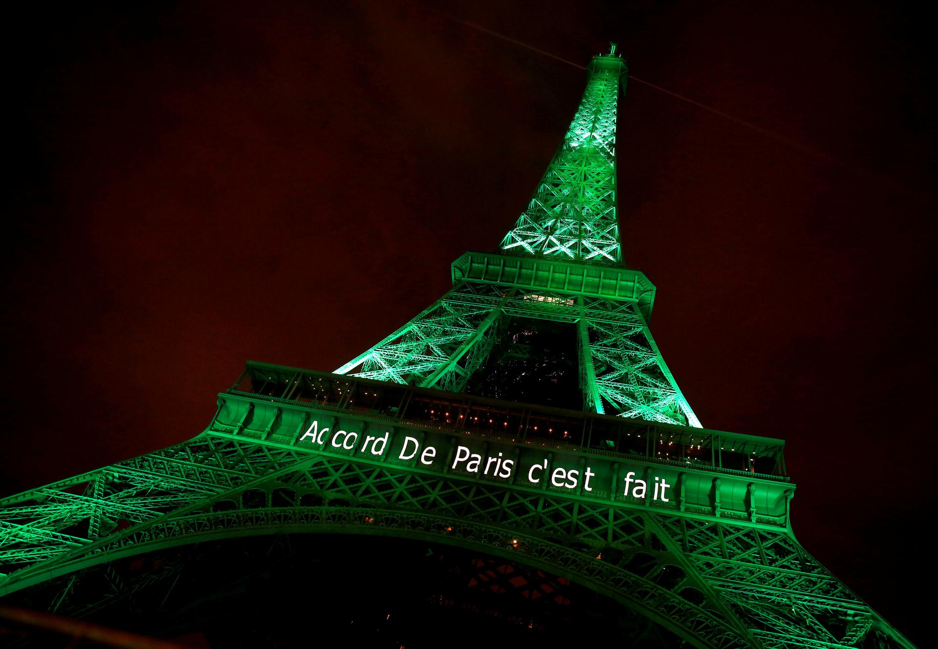 The Eiffel tower is illuminated in green with the words "Paris Agreement is Done", to celebrate the Paris U.N. COP21 Climate Change agreement in Paris, France, November 4, 2016.