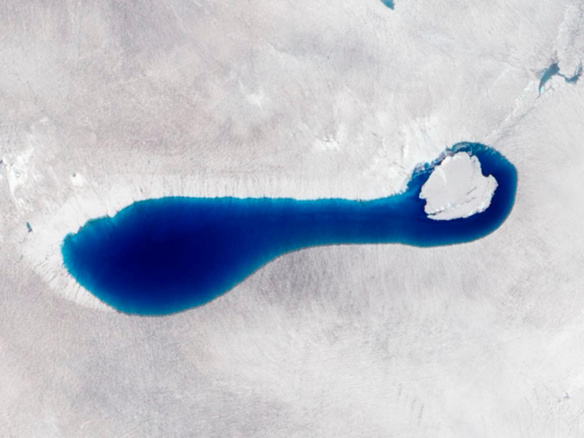 This natural-color image taken on July 4, 2010, by the Advanced Land Imager on NASA's Earth Observing-1 (EO-1) satellite, shows a sapphire-colored pond springing up as snow and ice melt atop the glaciers in southwestern Greenland.