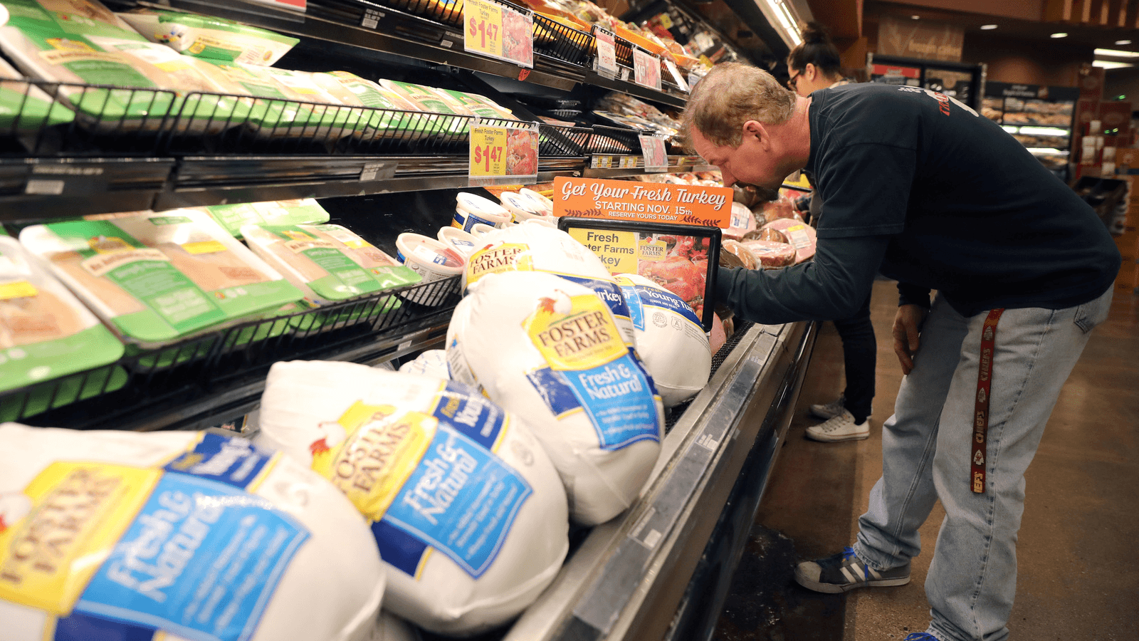 A customer shops for Thanksgiving ham at a grocery store in Los Angeles, California, Nov. 21, 2017. 