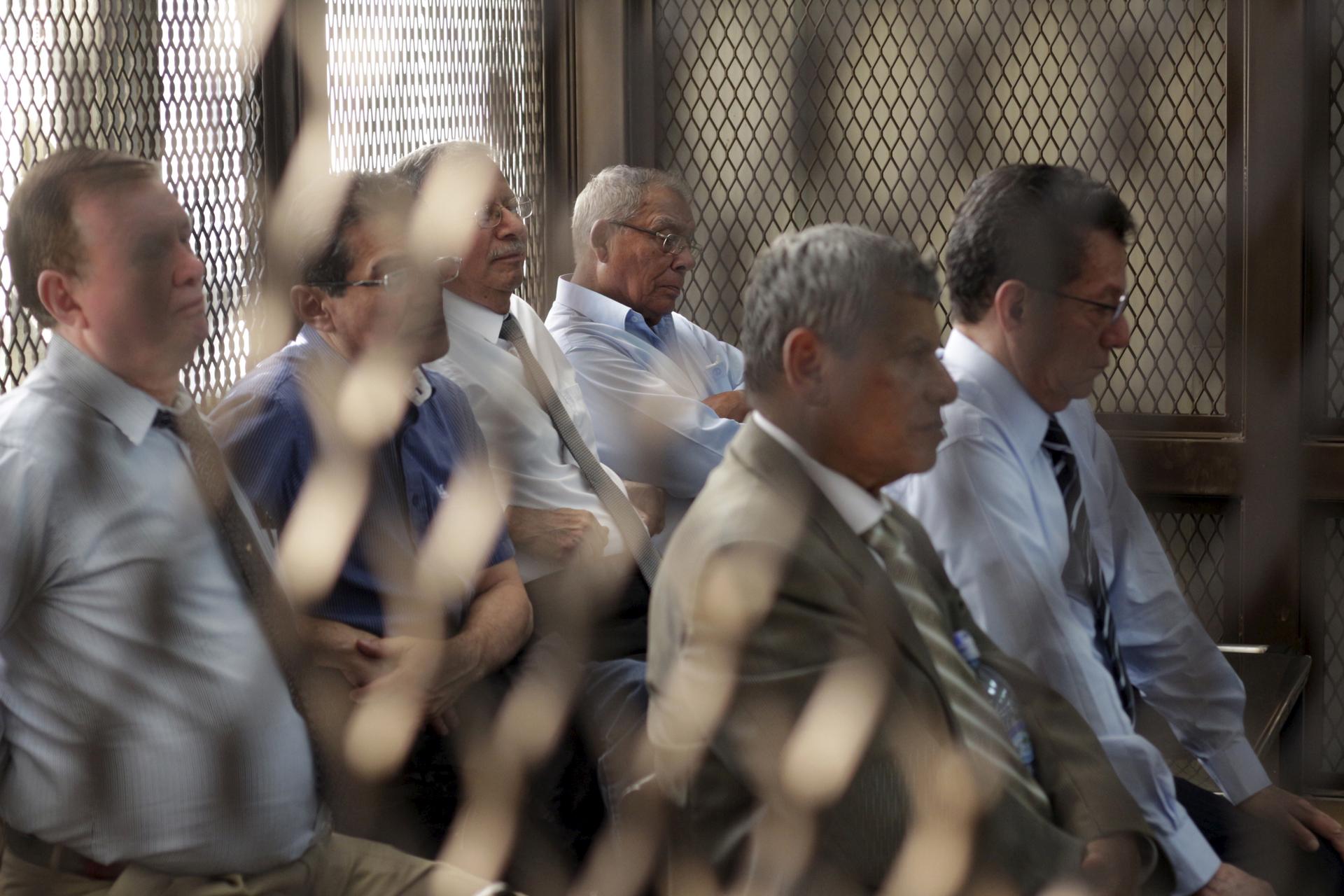 Retired military officers, from left, Luis Alberto Paredes, Byron Humberto Barrientos, Ismael Segura Abularach, Benedicto Lucas, Gustavo Alonzo Rosales and Carlos Augusto Garavito sit in a cage