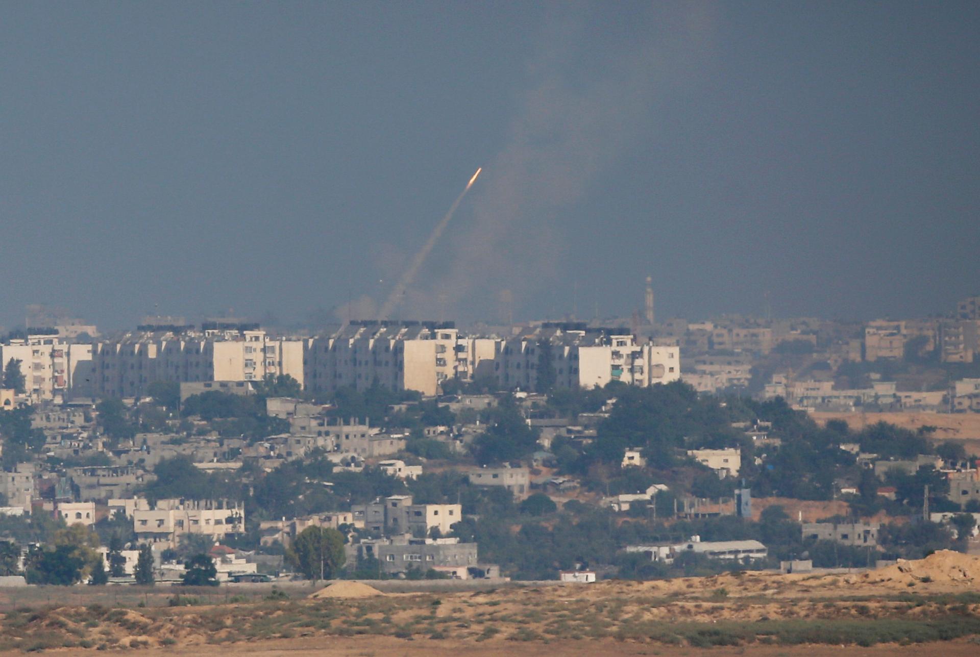 A smoke trail is seen as a rocket is launched towards Israel from the northern Gaza Strip July 11, 2014.