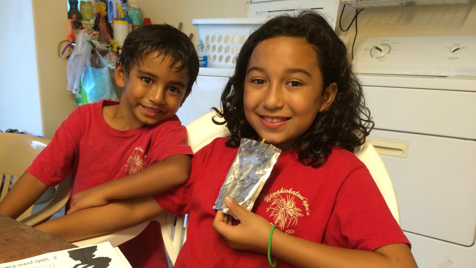 Third-grader Haveo Maka'imoku with her brother. Haveo learns entirely in Hawaiian at a school in Hilo, Hawaii. At home, she speaks Hawaiian with mother, who attended one of the first Hawaiian language pre-schools founded in the 1980s. 
