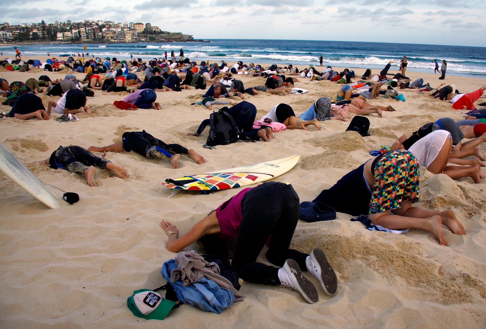 Protesters with their heads in the sand
