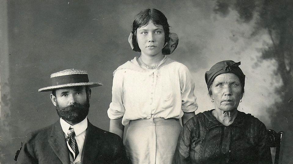 A Russian family migrating to Hawaii pose for a passport photo. 