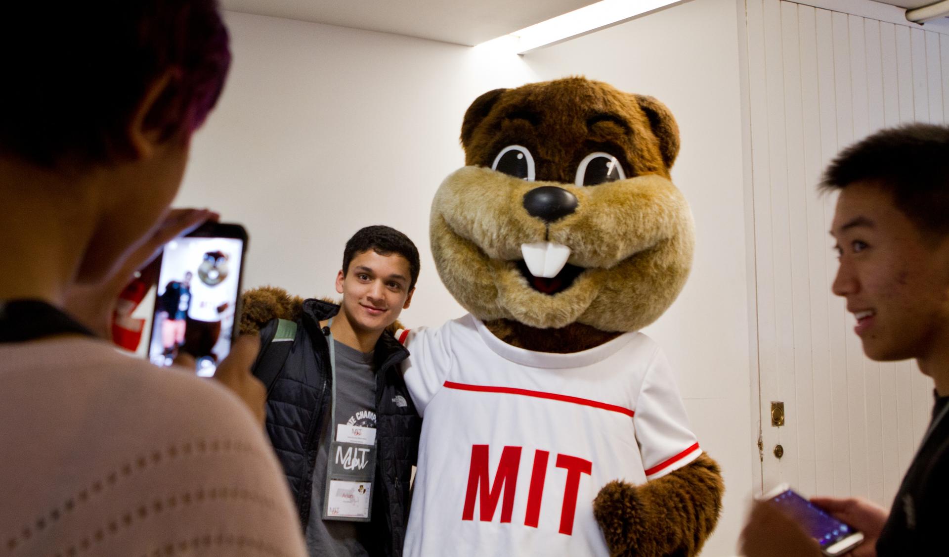 Admitted MIT students pose with the school's mascot during a weekend of activities at the university.