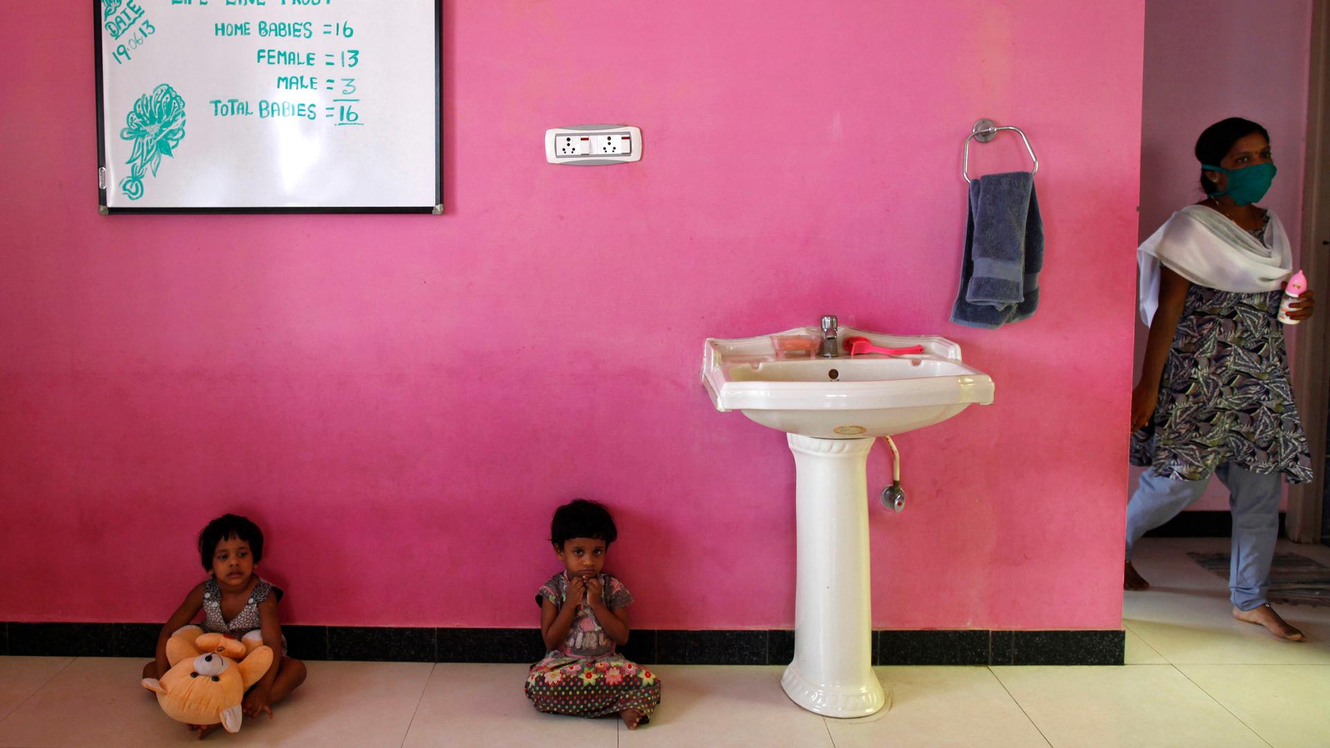 Girls sit inside the Life Line Trust orphanage in Salem in the southern Indian state of Tamil Nadu on June 20, 2013.