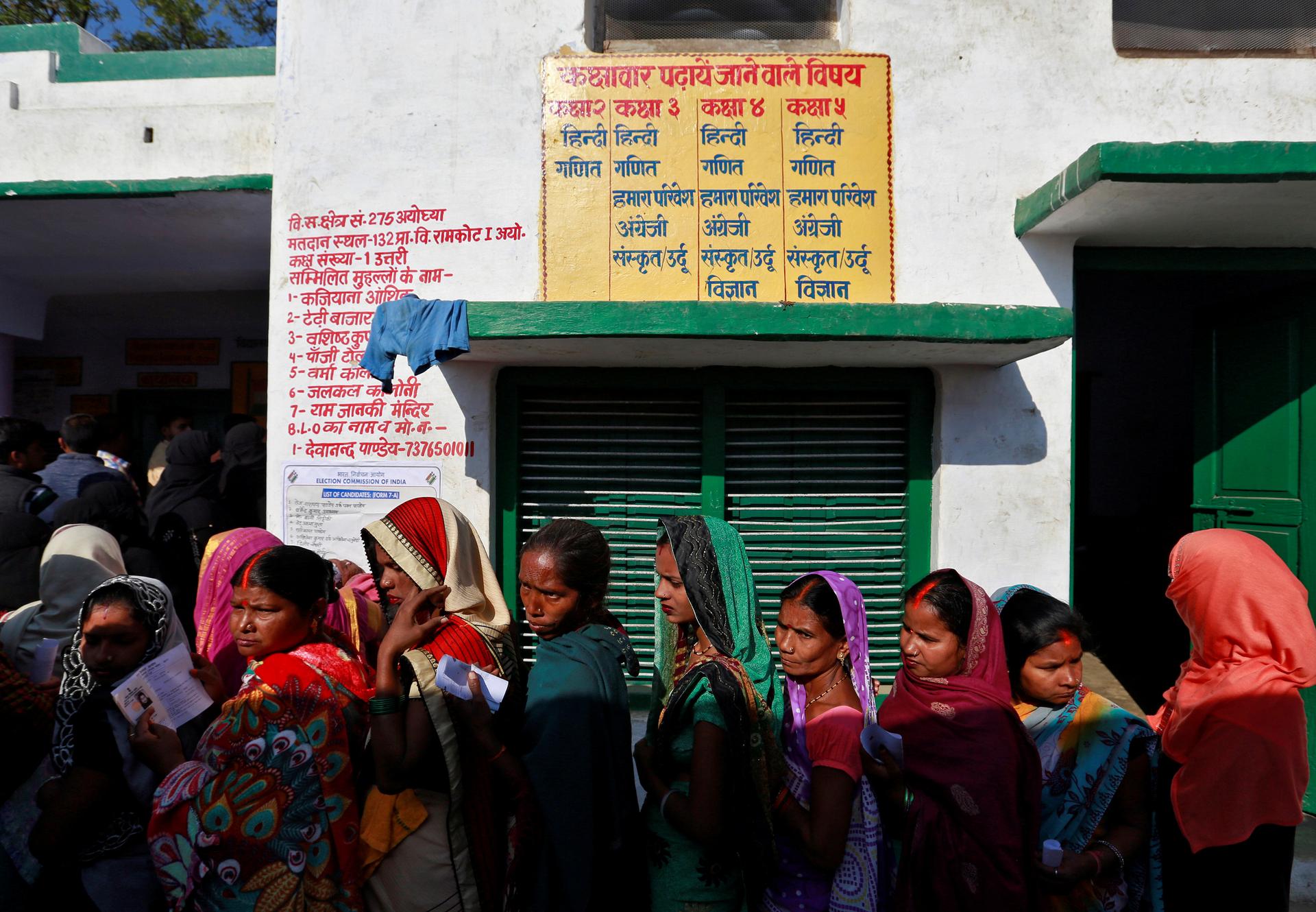 Women queue up to vote during the state assembly election, in the town of Ayodhya, in the state of Uttar Pradesh, India, February 27, 2017.
