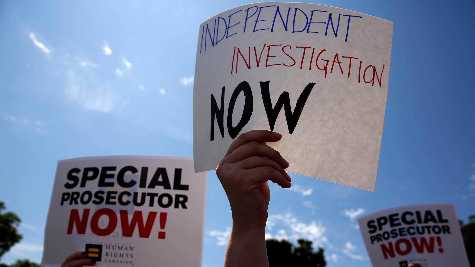 Protesters gather to rally against U.S. President Donald Trump's firing of Federal Bureau of Investigation (FBI) Director James Comey, outside the White House in Washington, U.S. May 10, 2017.