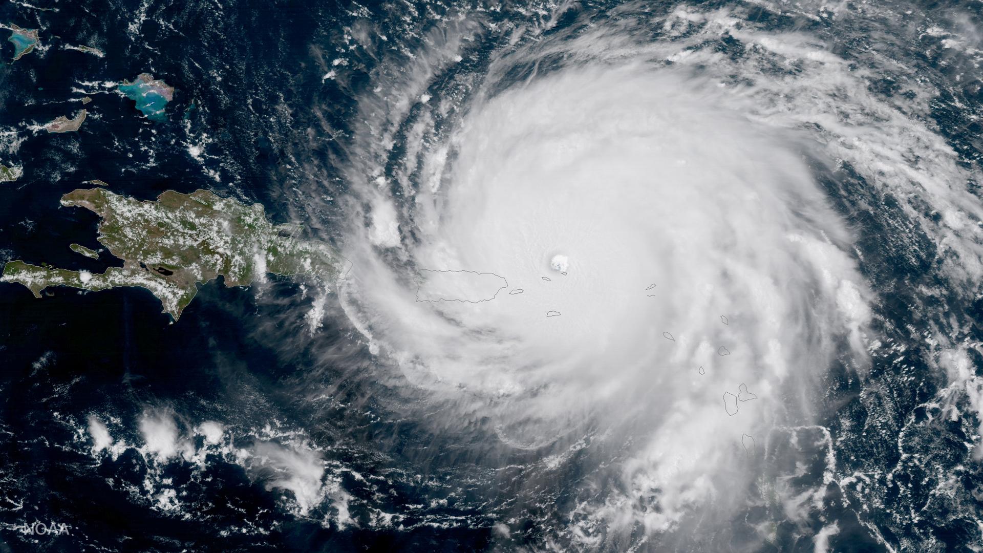 Hurricane Irma, a record Category 5 storm, passes over Barbuda and other Caribbean islands in this NOAA National Weather Service National Hurricane Center satellite image taken on September 6, 2017.