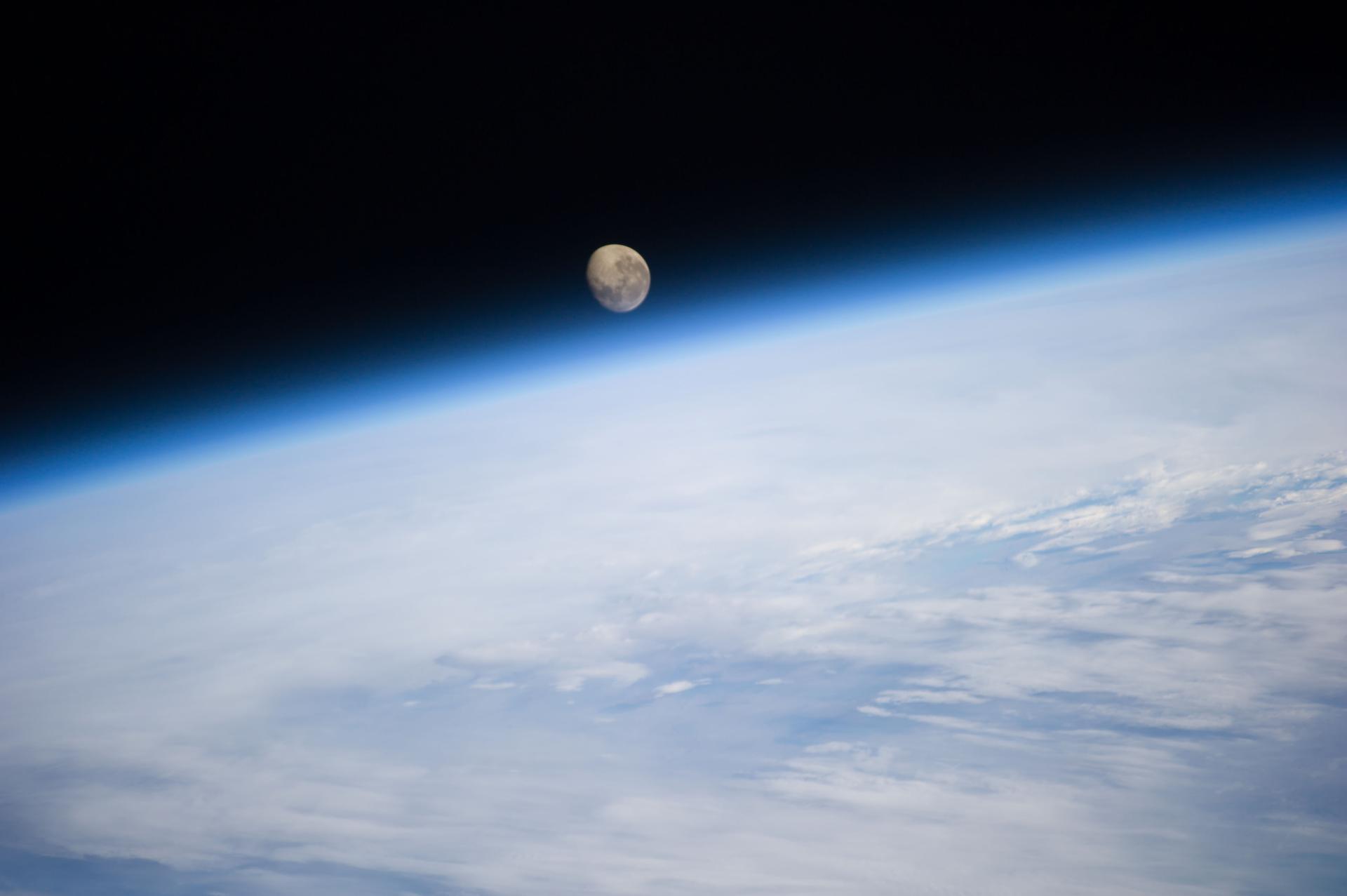 The moonset behind Earth, as viewed from the International Space Station.
