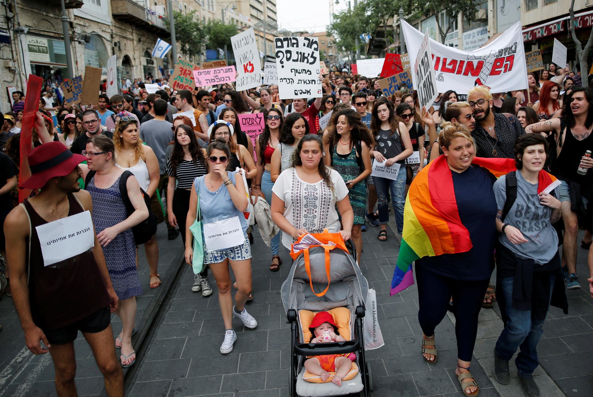 People take part in a "SlutWalk" protest, during which several hundred participants march through the centre of Jerusalem, May 13, 2016.