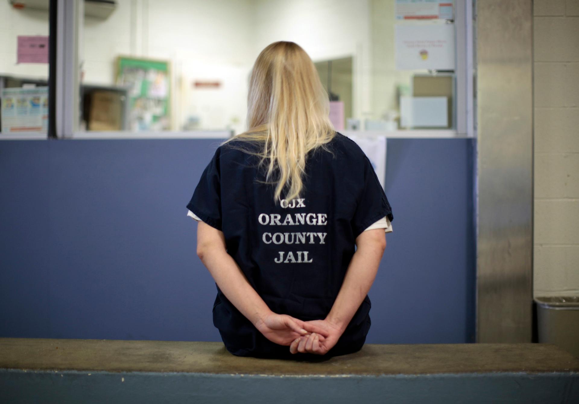 An inmate is checked into the Orange County jail in Santa Ana, California, on May 24, 2011.