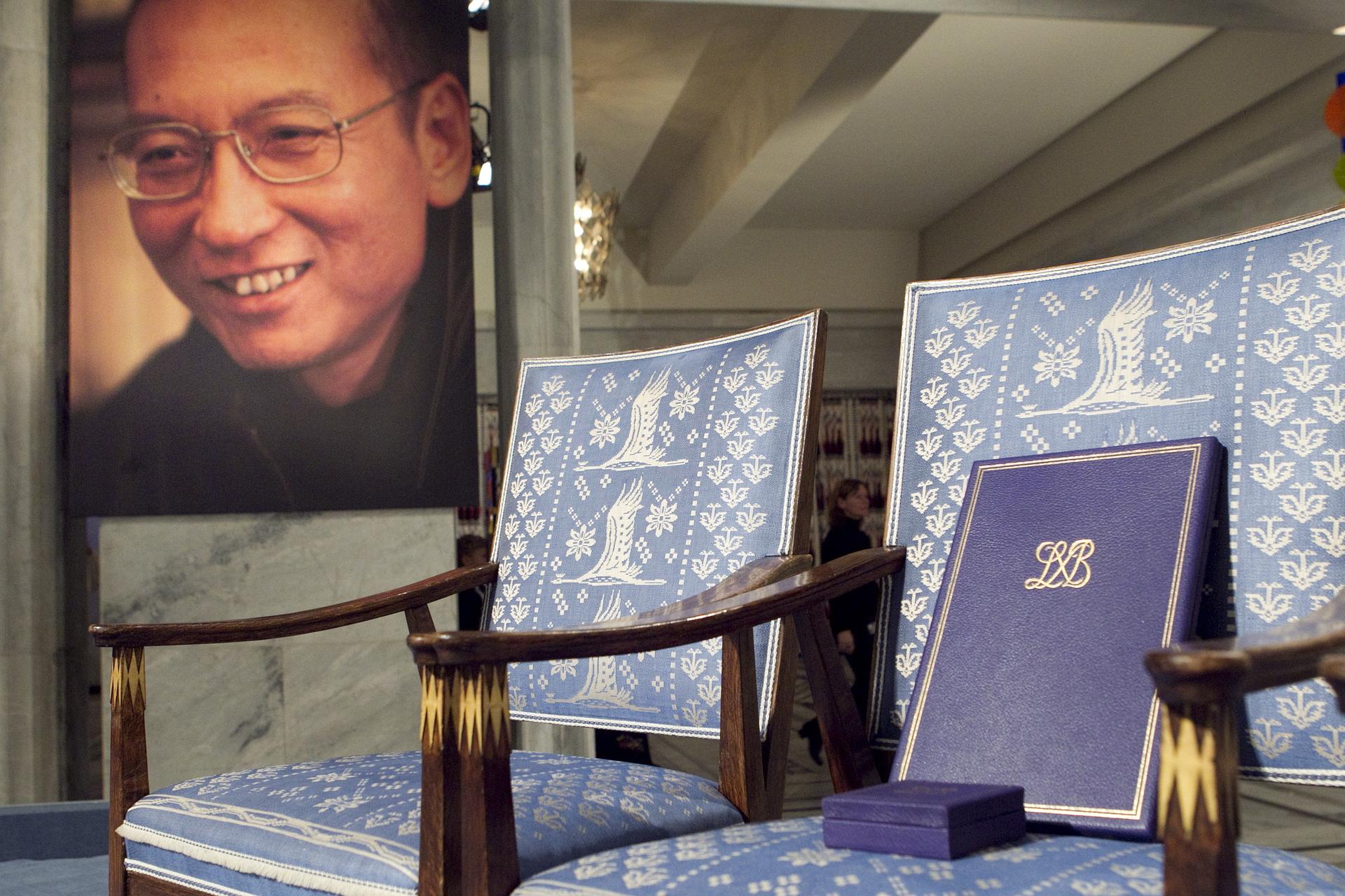 The Nobel certificate and medal is seen on the empty chair where Nobel Peace Prize winner jailed Chinese dissident Liu Xiaobo would have sat