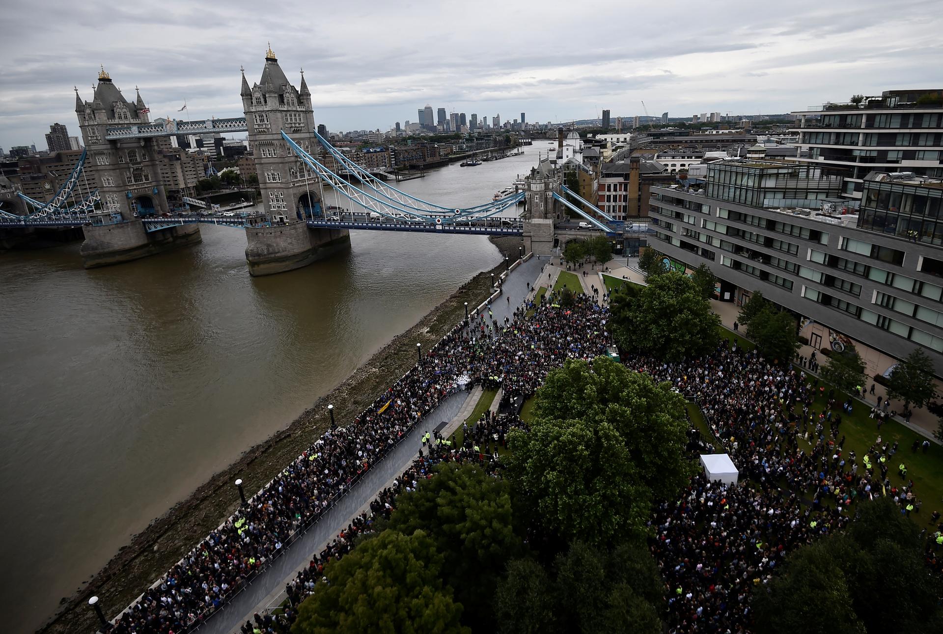 People attend a vigil to remember the victims of the attack on London Bridge and Borough Market, at Potters Field Park, in central London, Britain, June 5, 2017.