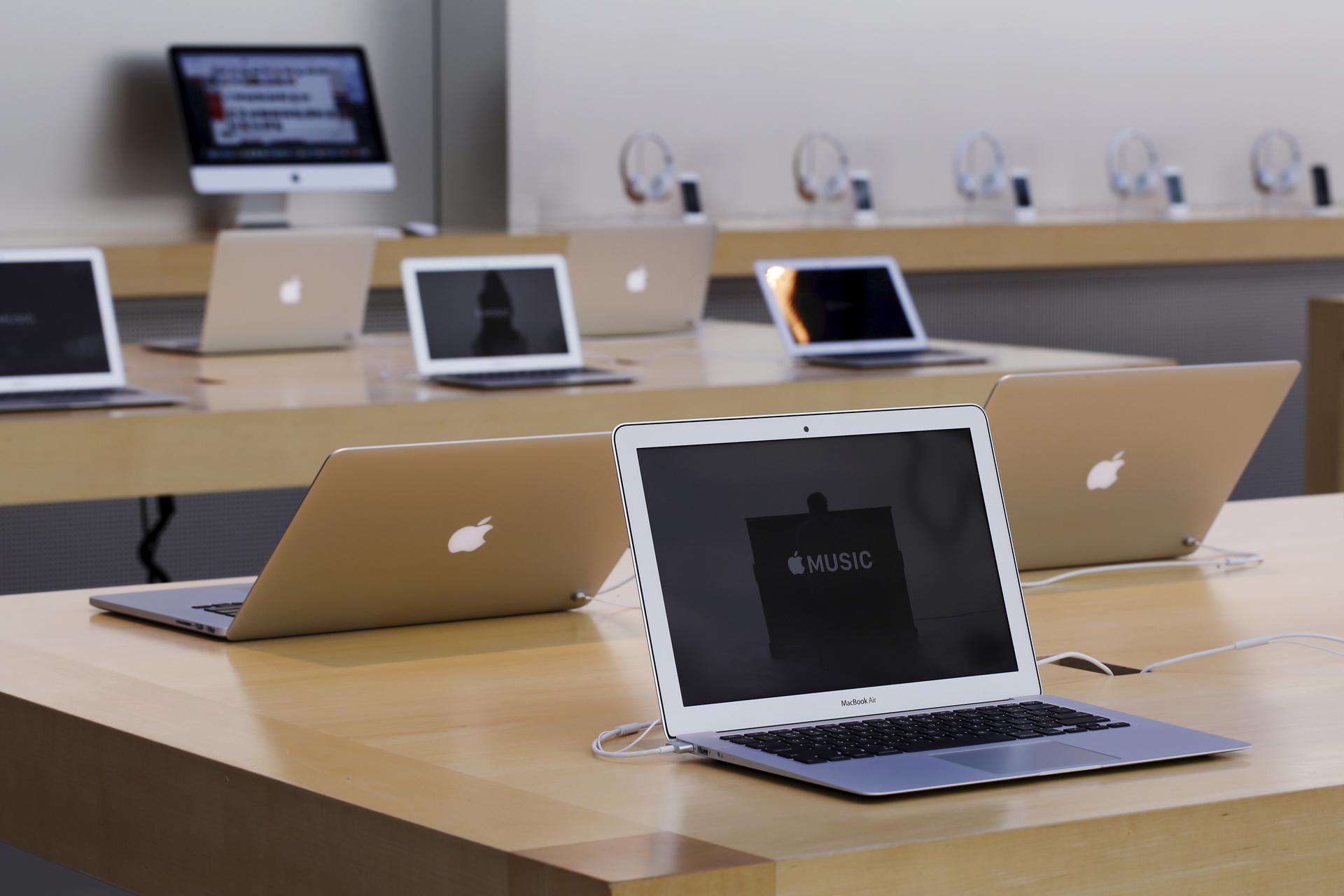 Rows of Apple laptop computers