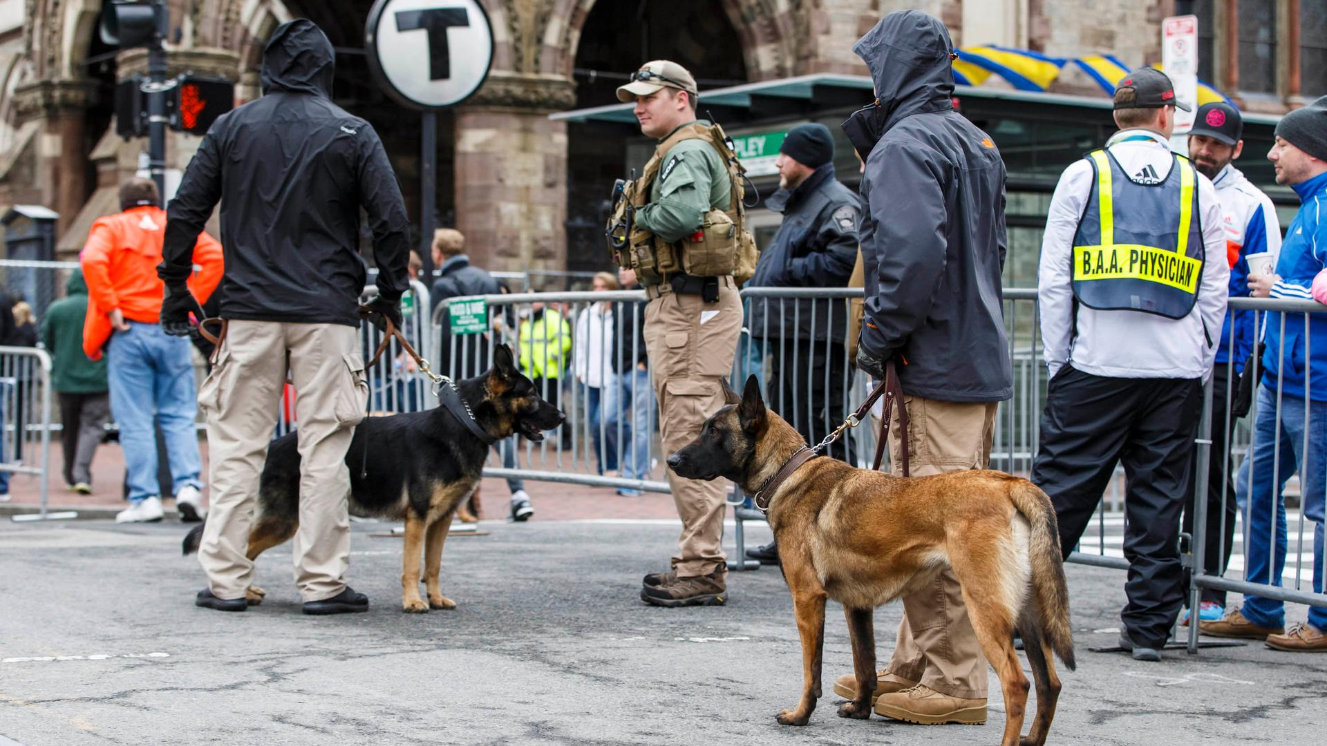 Security personnel stand along Boylston Street near the finish line of the 119th Boston Marathon, held on April 20, 2015.