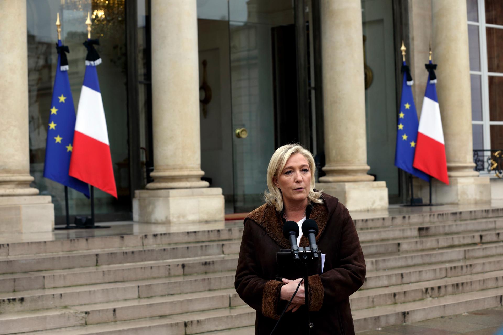 France's far-right National Front political party leader Marine Le Pen speaks to journalists as she leaves after a meeting at the Elyseé palace in Paris on January 9, 2015.